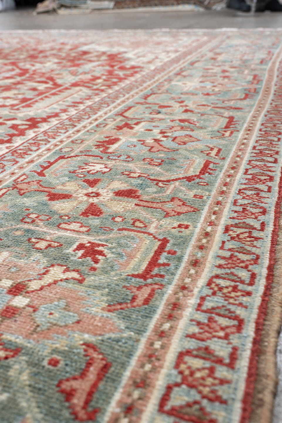 9' x 12' one-of-a-kind handmade antique Heriz large size rug. Color palette: rust, sky blue, ivory, terra cotta, sage, cream