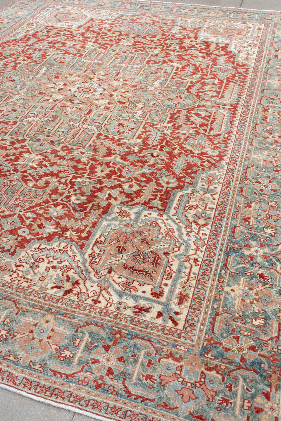 9' x 12' one-of-a-kind handmade antique Heriz large size rug. Color palette: rust, sky blue, ivory, terra cotta, sage, cream