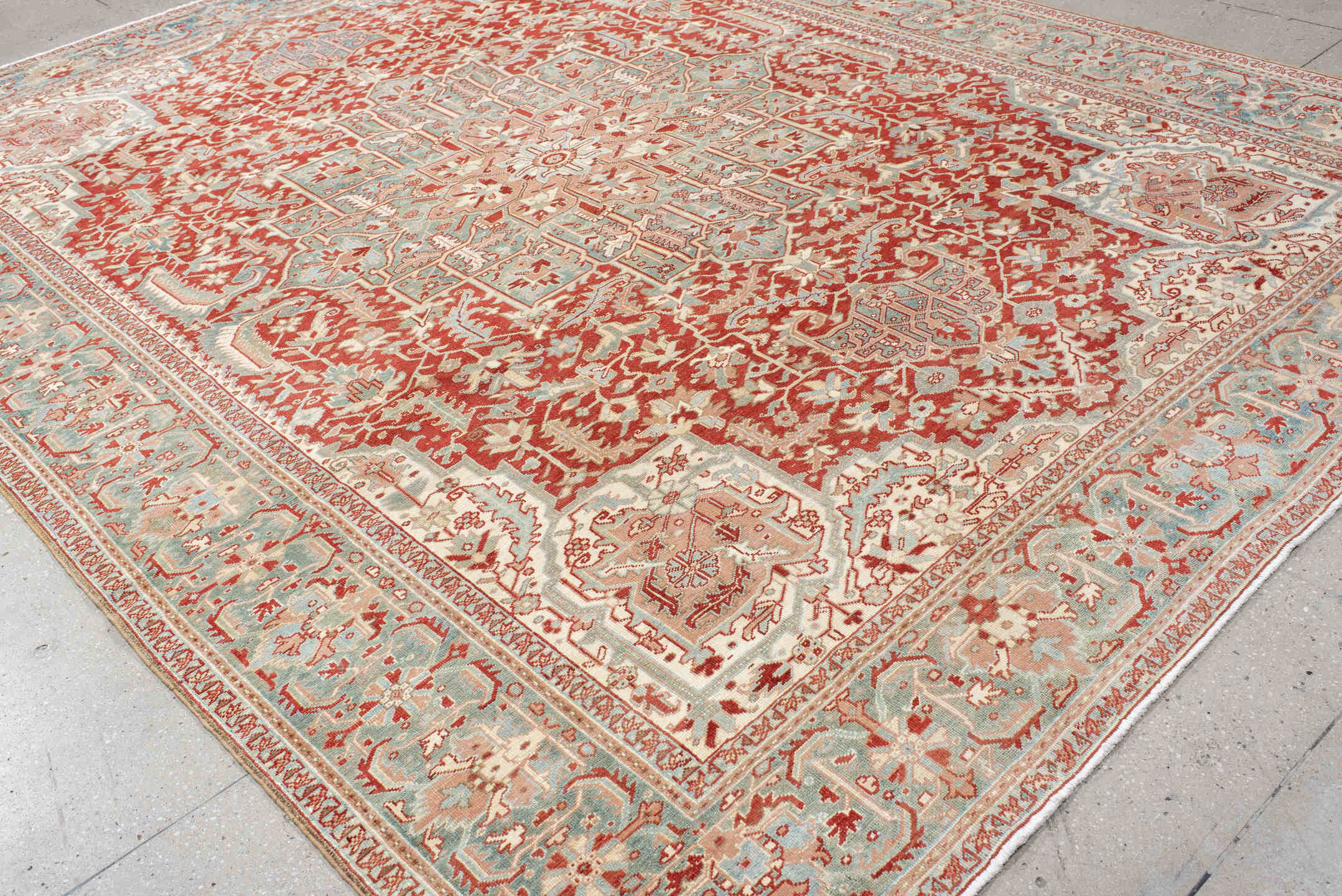 9' x 12' one-of-a-kind handmade antique Heriz large size rug. Color palette: rust, sky blue, ivory, terra cotta, sage, cream