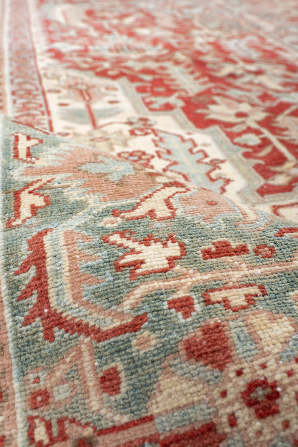 9' x 12' one-of-a-kind handmade antique Heriz large size rug. Color palette: rust, sky blue, ivory, terra cotta, sage, cream