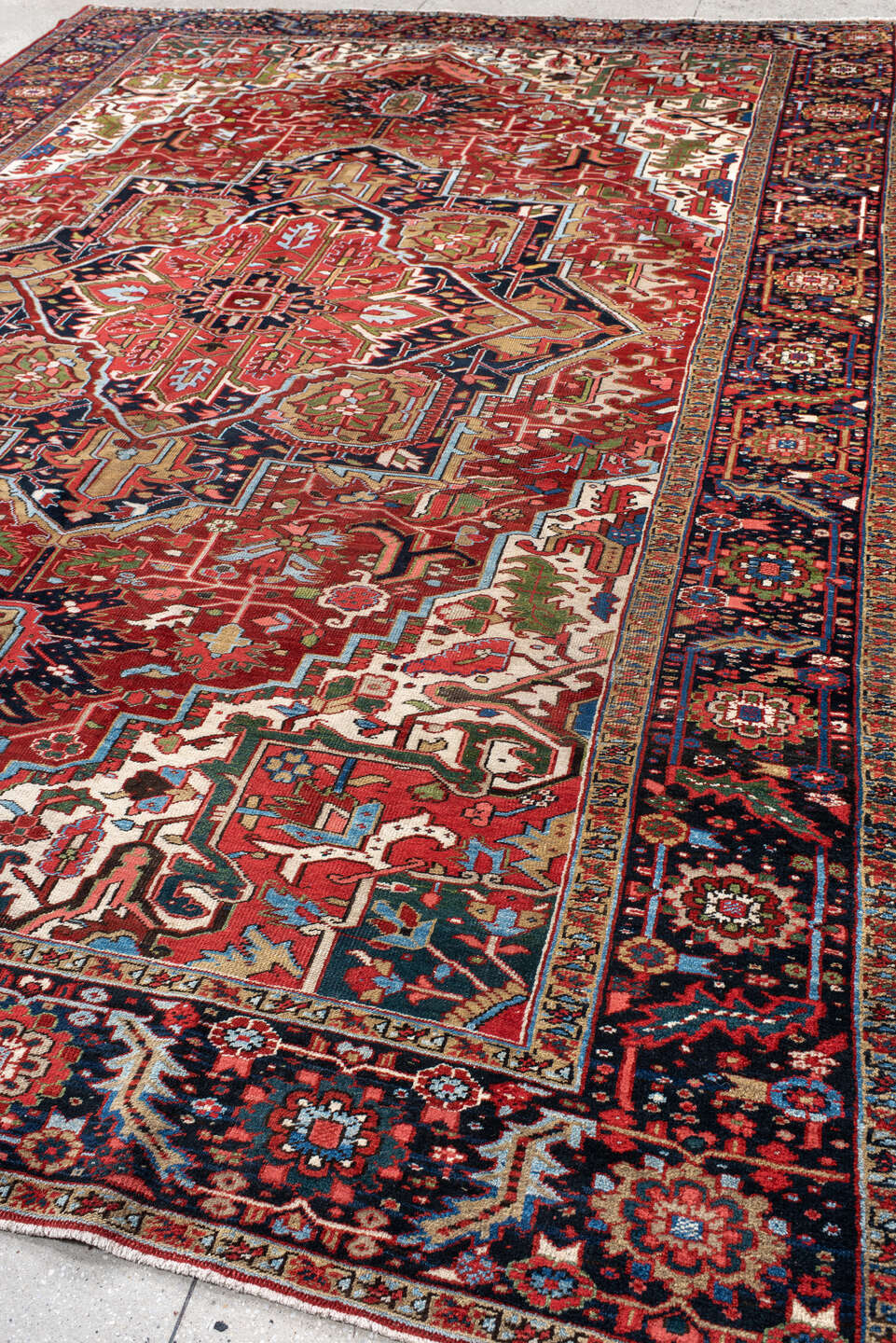 9' x 13' one-of-a-kind handmade antique Heriz large size rug. Color palette: rust, navy, ivory, brick, sage, sky blue, camel