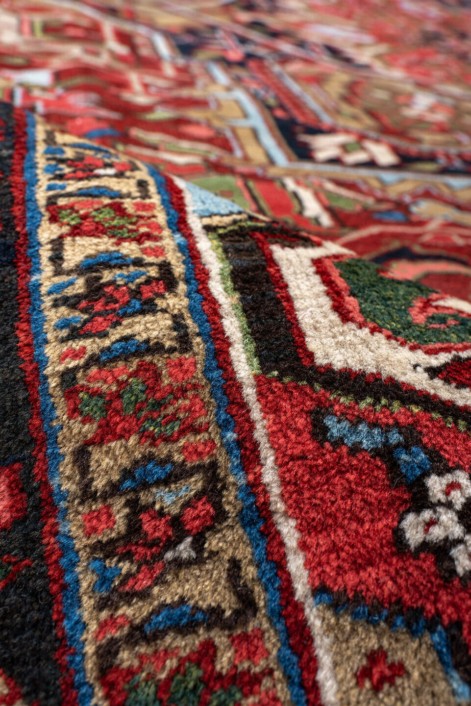 9' x 13' one-of-a-kind handmade antique Heriz large size rug. Color palette: rust, navy, ivory, brick, sage, sky blue, camel