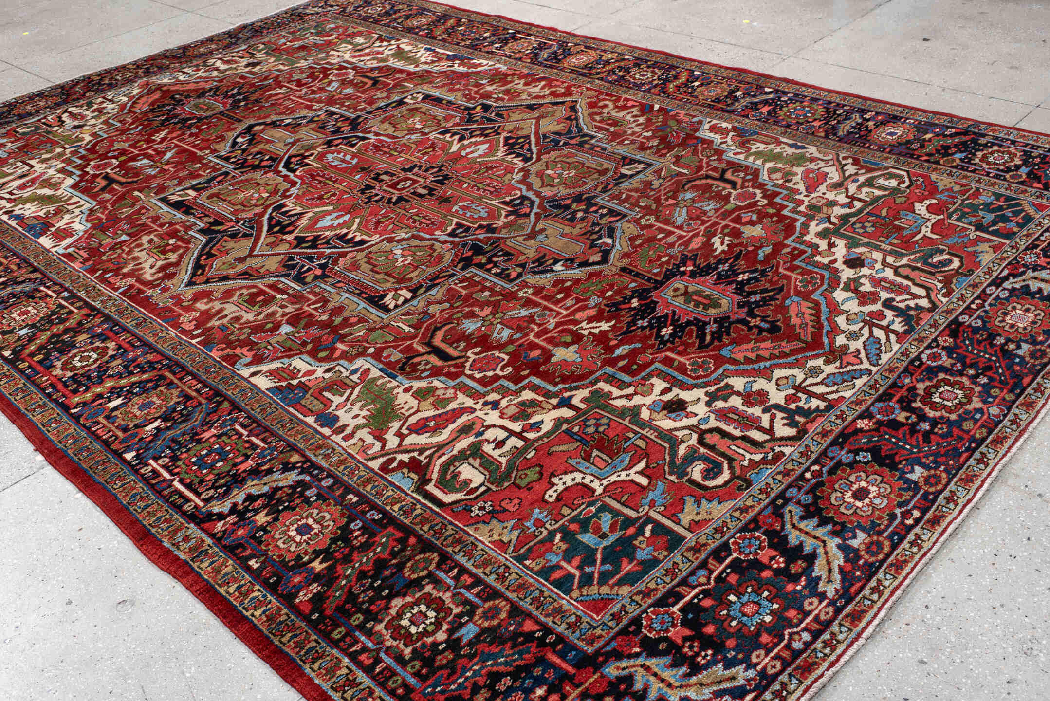 9' x 13' one-of-a-kind handmade antique Heriz large size rug. Color palette: rust, navy, ivory, brick, sage, sky blue, camel