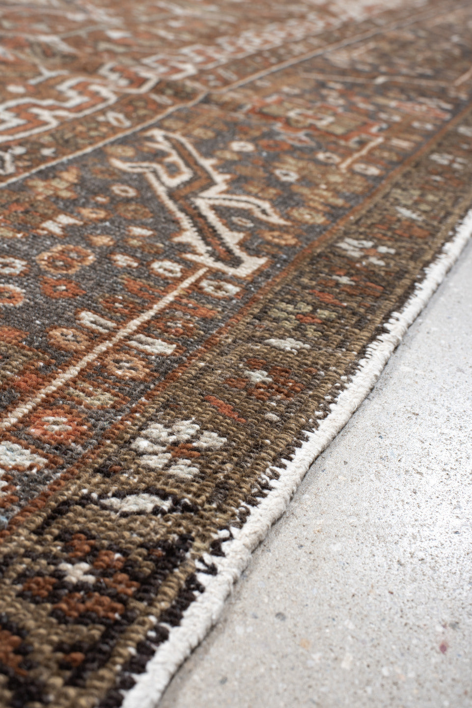 9' x 12' one-of-a-kind handmade antique Karaje large size rug. Color palette: rust, ivory, indigo, brown, terra cotta, slate