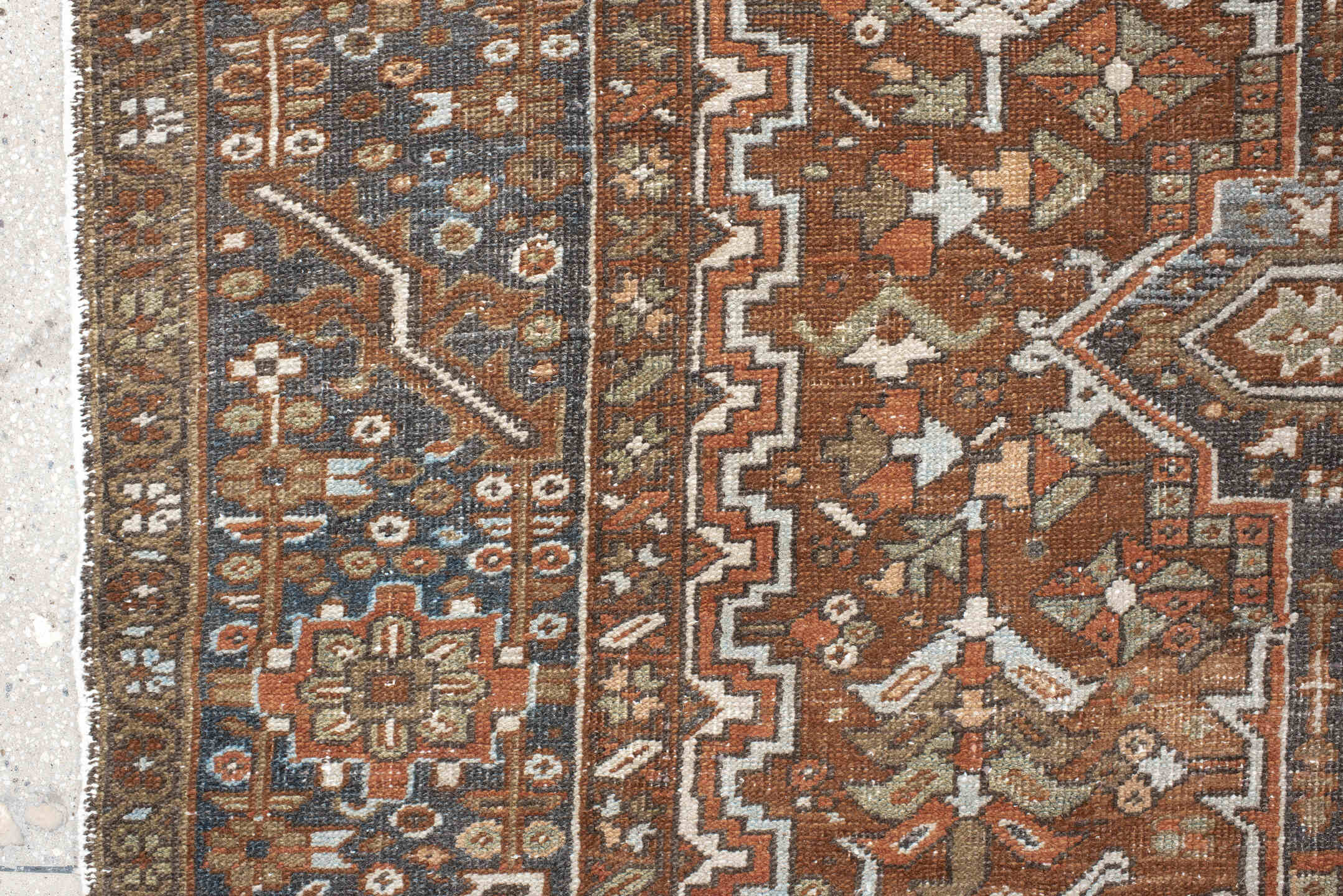 9' x 12' one-of-a-kind handmade antique Karaje large size rug. Color palette: rust, ivory, indigo, brown, terra cotta, slate