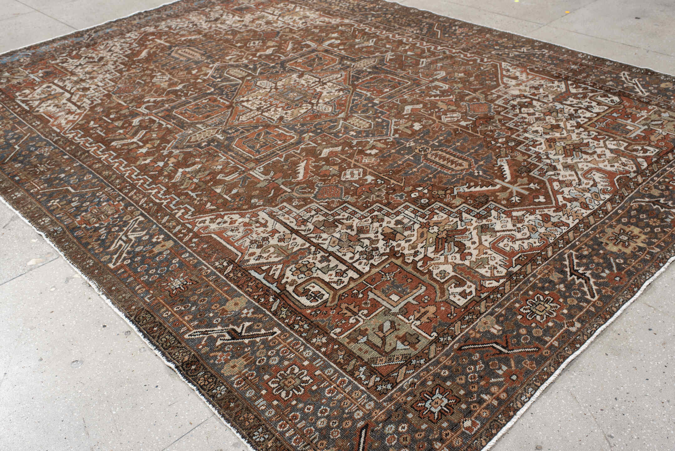 9' x 12' one-of-a-kind handmade antique Karaje large size rug. Color palette: rust, ivory, indigo, brown, terra cotta, slate