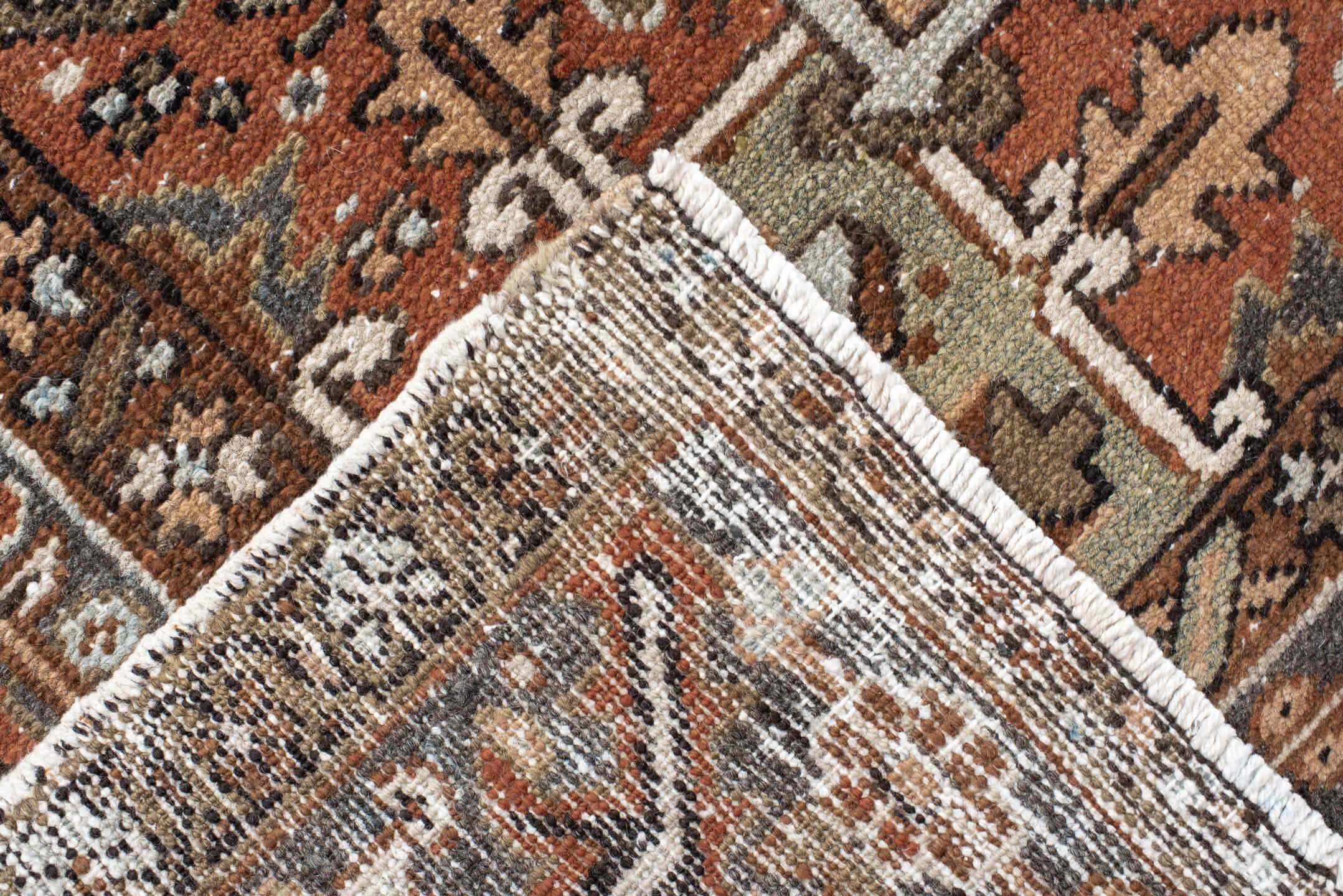 9' x 12' one-of-a-kind handmade antique Karaje large size rug. Color palette: rust, ivory, indigo, brown, terra cotta, slate