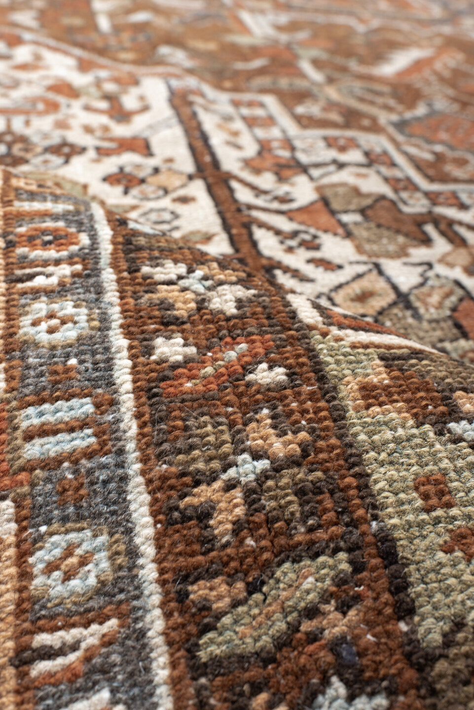 9' x 12' one-of-a-kind handmade antique Karaje large size rug. Color palette: rust, ivory, indigo, brown, terra cotta, slate