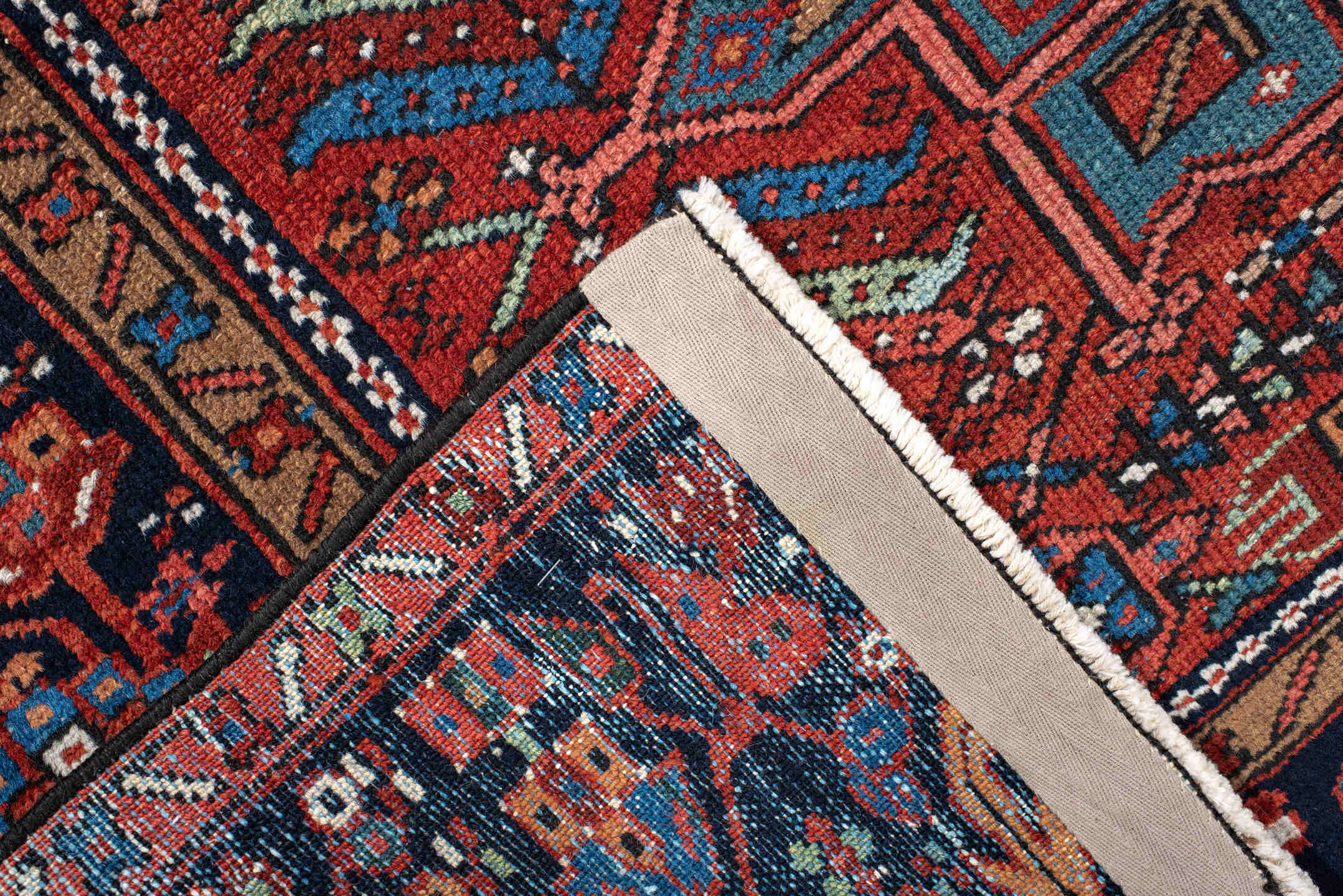 4' x 6' one-of-a-kind handmade antique Karaje small size rug. Color palette: rust, navy, ivory, sky_blue, crimson, teal