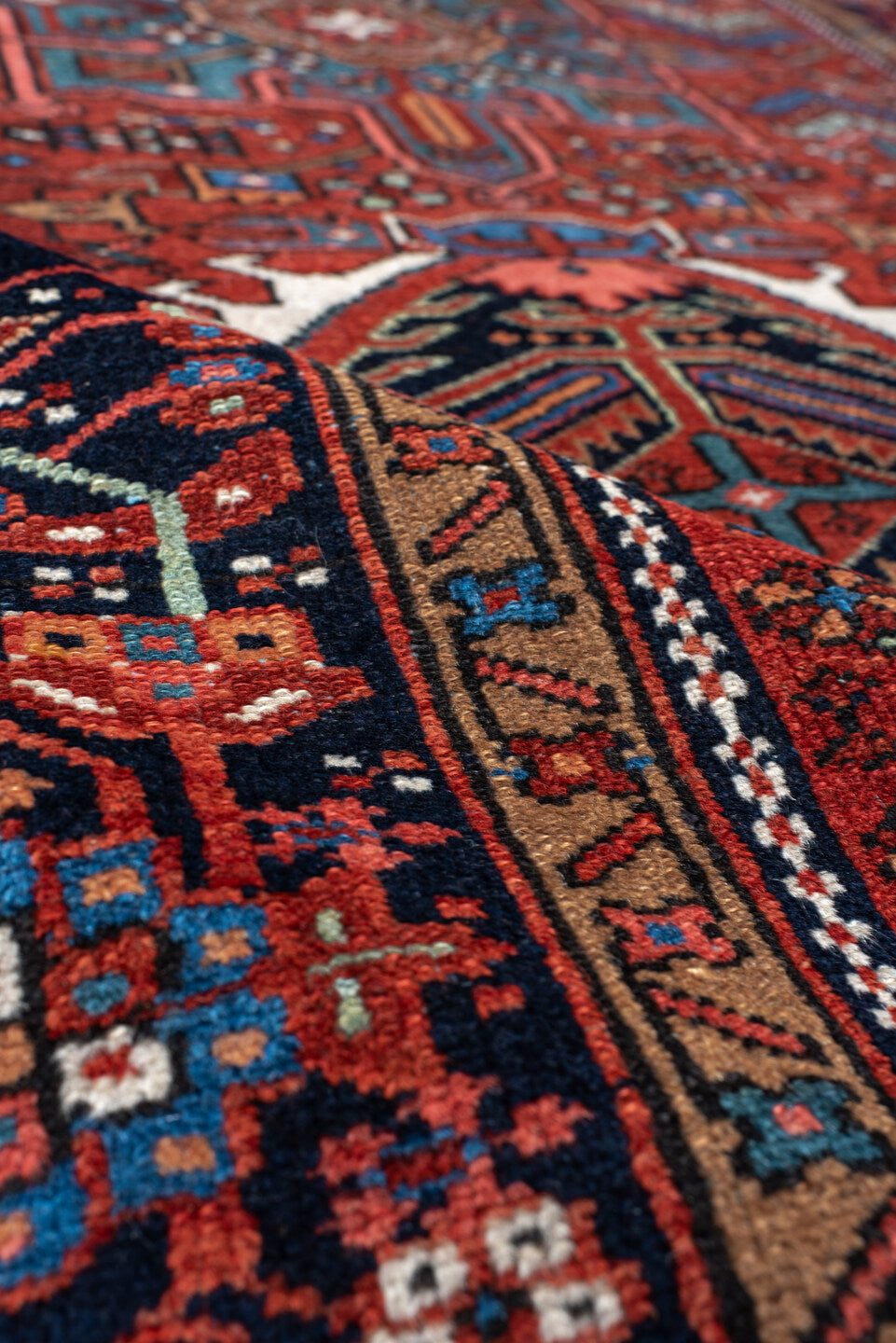 4' x 6' one-of-a-kind handmade vintage Karaje small size rug. Color palette: black, blue, brown, fire brick, gray, off-white