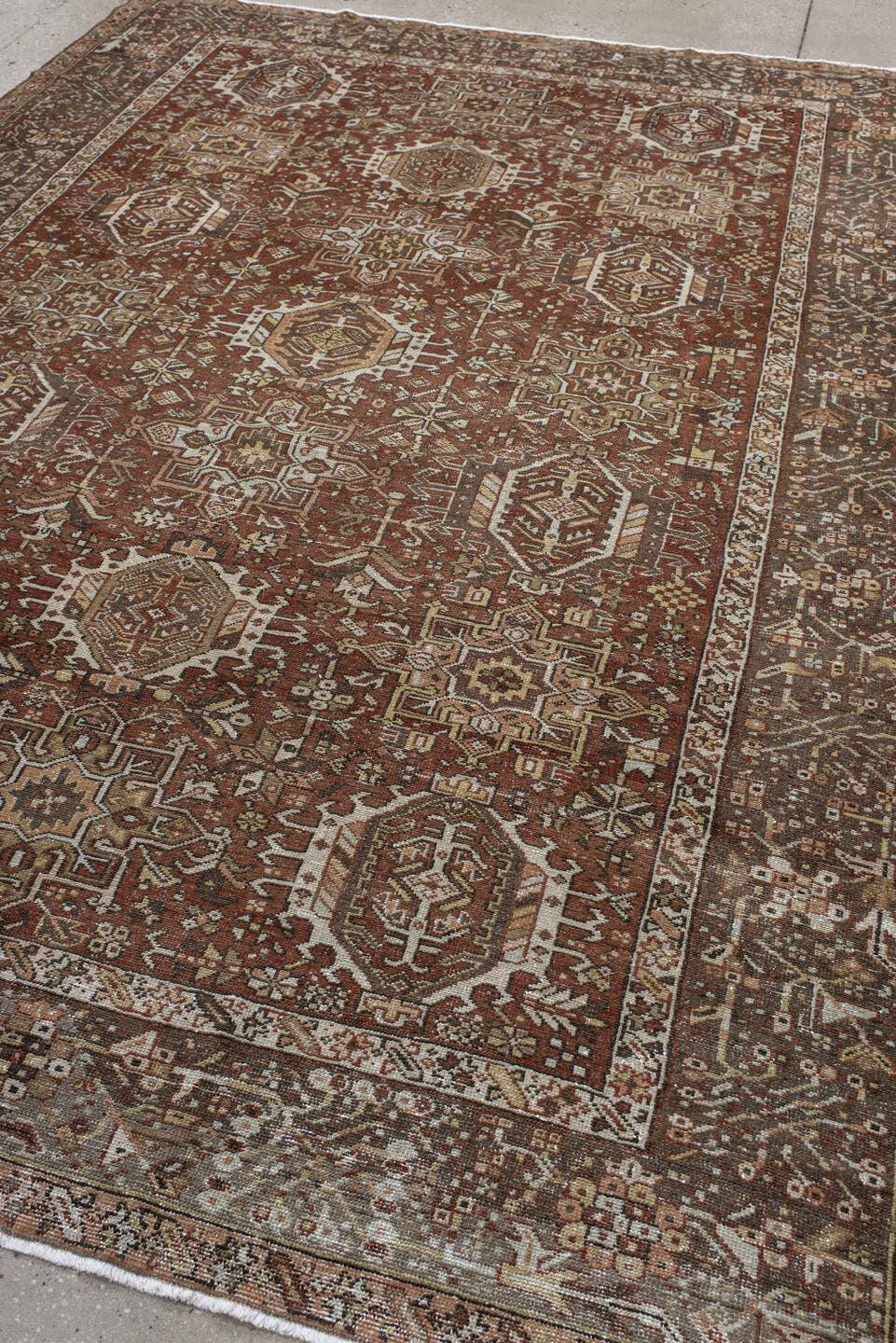 7' x 9' one-of-a-kind handmade antique Karaje rug. Color palette: rust, brown, ivory, taupe, camel, charcoal, terracotta