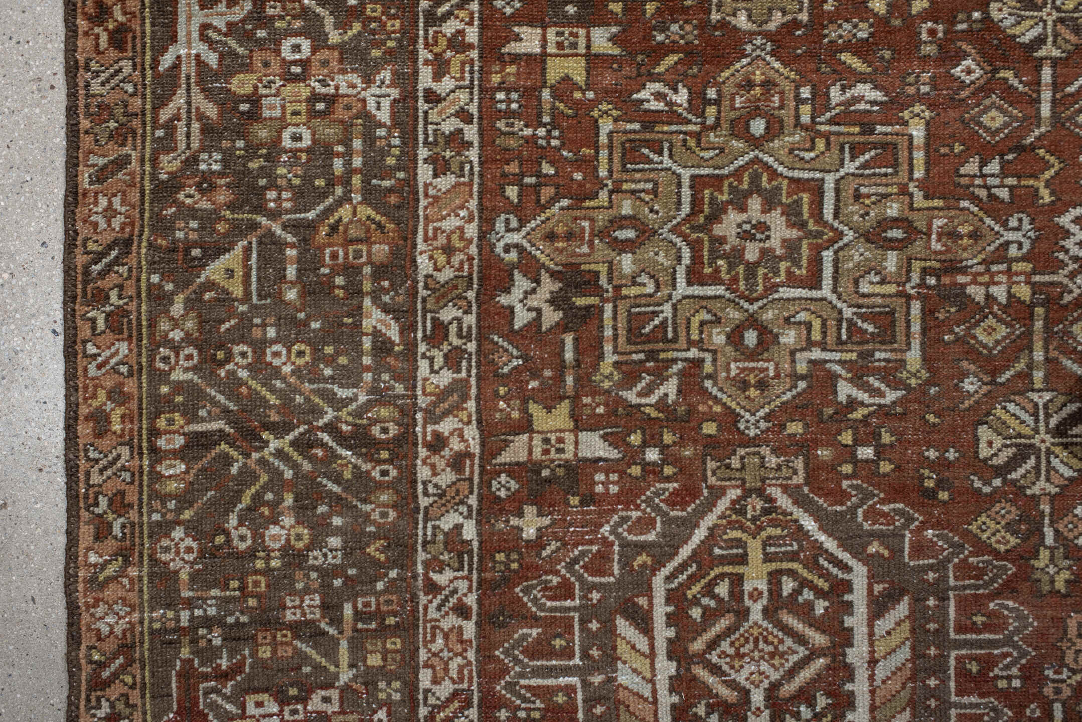 7' x 9' one-of-a-kind handmade vintage Karaje rug. Color palette: brown, gray, light gray, off-white