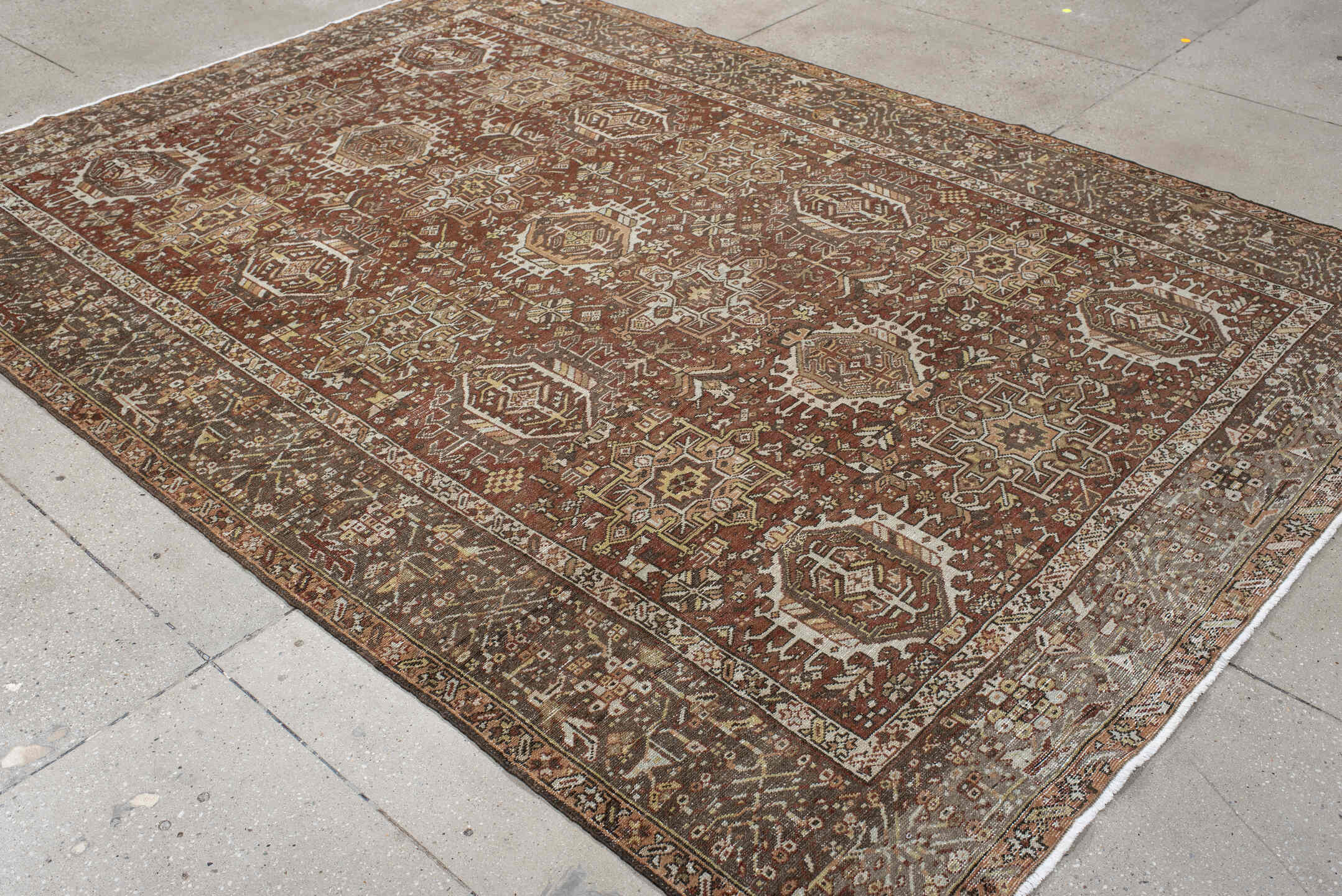 7' x 9' one-of-a-kind handmade vintage Karaje rug. Color palette: brown, gray, light gray, off-white