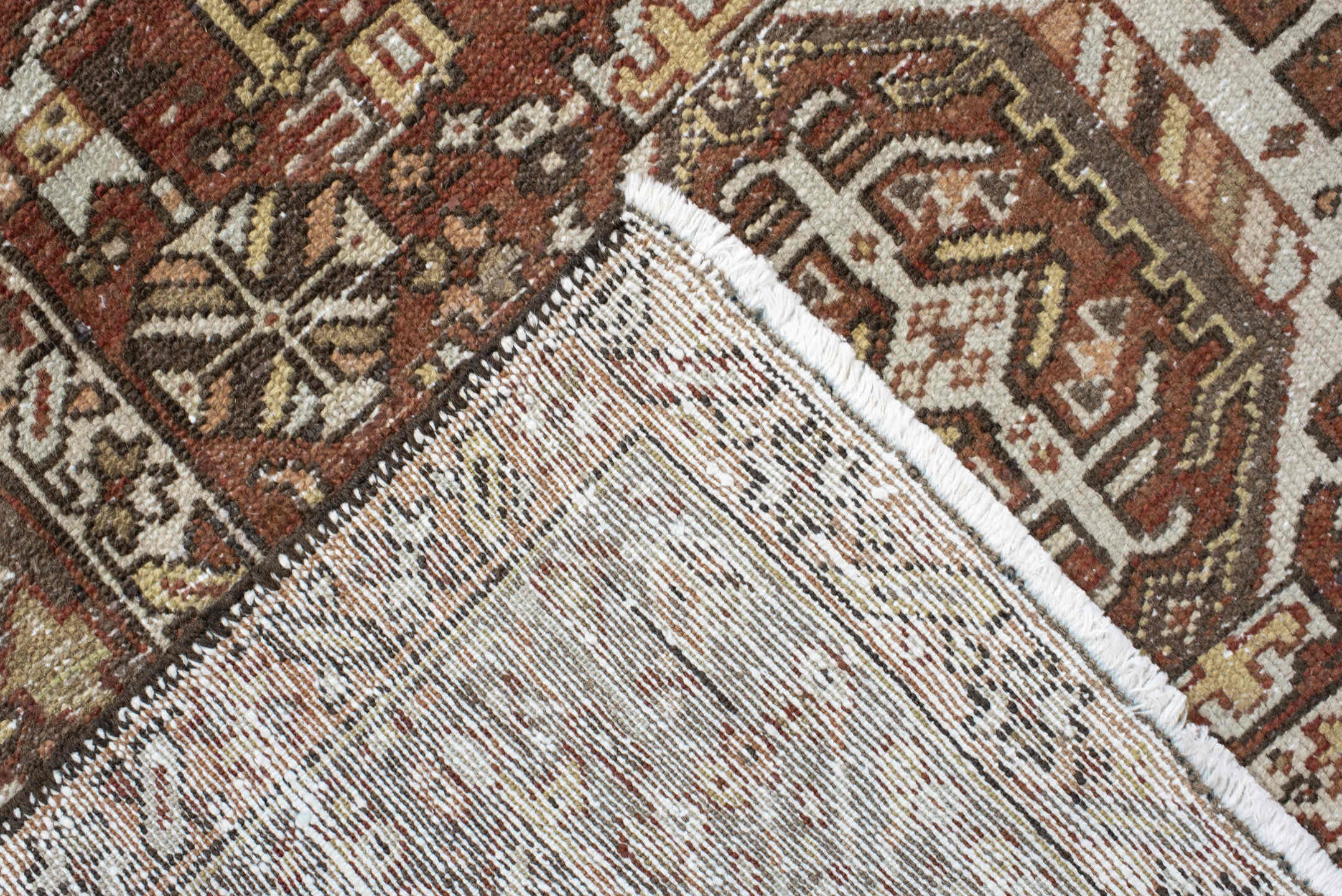 7' x 9' one-of-a-kind handmade antique Karaje rug. Color palette: rust, brown, ivory, taupe, camel, charcoal, terracotta