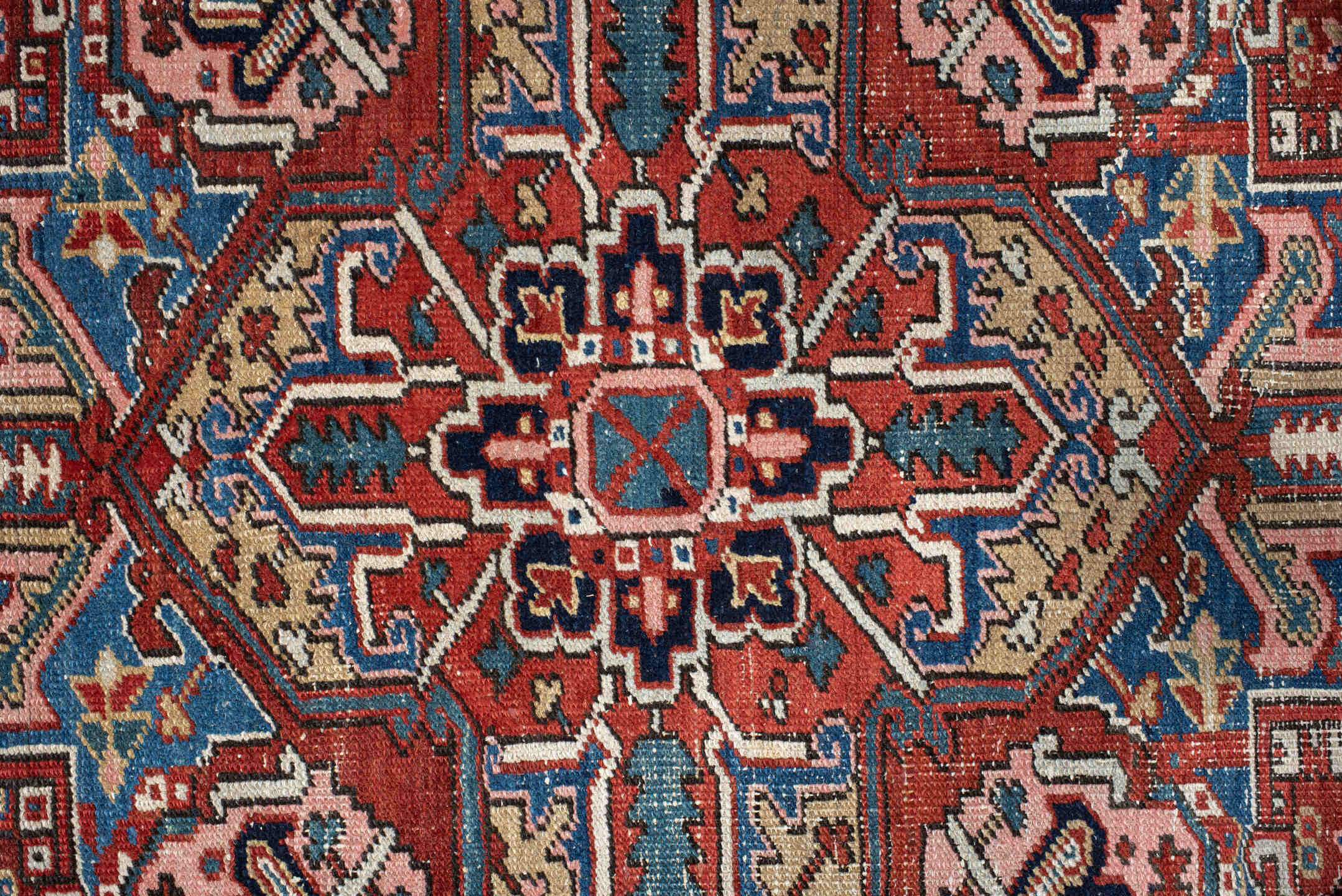 7' x 10' one-of-a-kind handmade antique Heriz large size rug. Color palette: rust, ivory, navy, sky_blue, brick, coral
