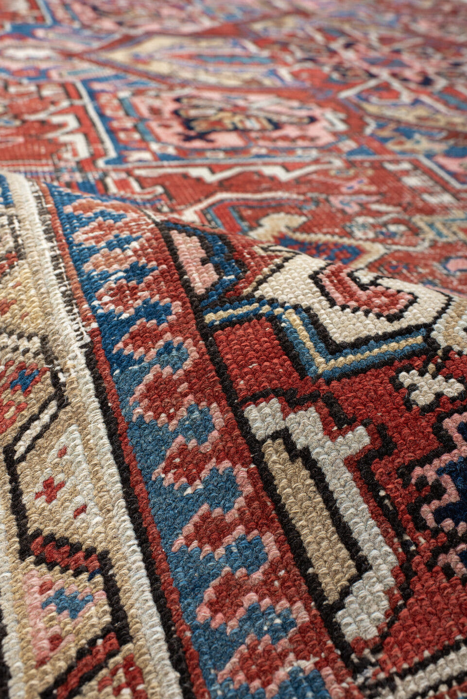 7' x 10' one-of-a-kind handmade antique Heriz large size rug. Color palette: rust, ivory, navy, sky_blue, brick, coral