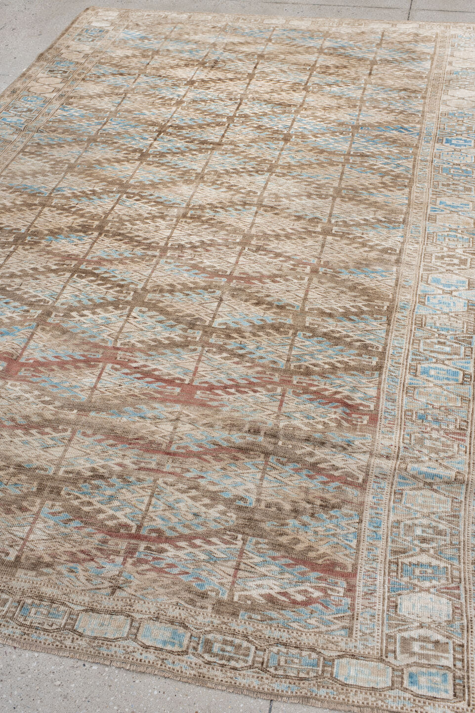 6' x 9' one-of-a-kind handmade antique Yamoud medium size rug. Color palette: ivory, taupe, camel, sky blue, brown, rose