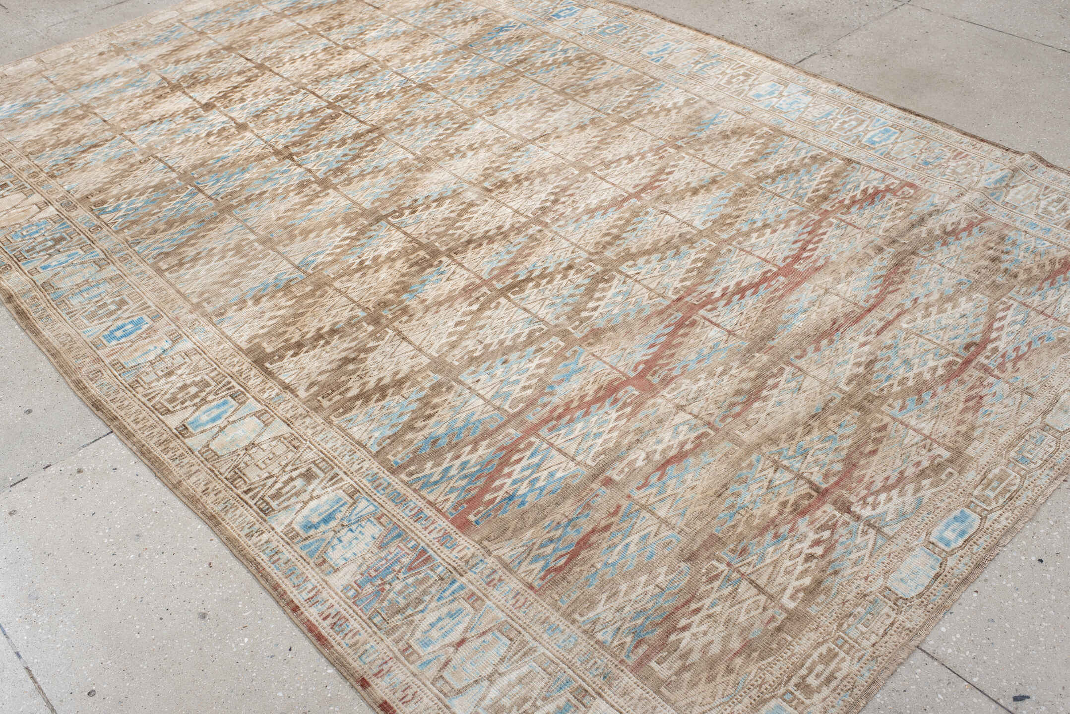 6' x 9' one-of-a-kind handmade antique Yamoud medium size rug. Color palette: ivory, taupe, camel, sky blue, brown, rose