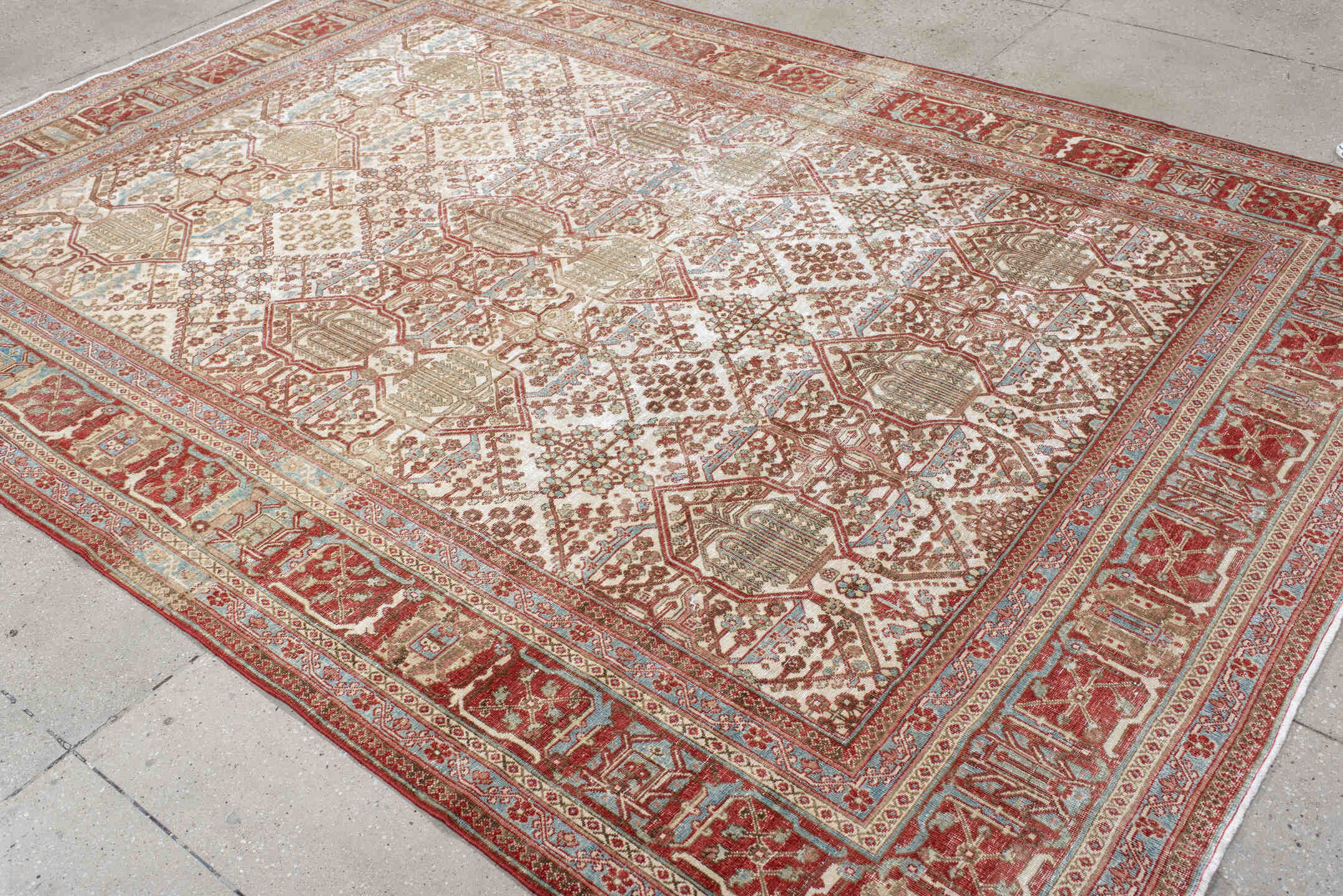 7' x 10' one-of-a-kind handmade antique Joshegan large size rug. Color palette: ivory, rust, sky_blue, camel, brick, taupe