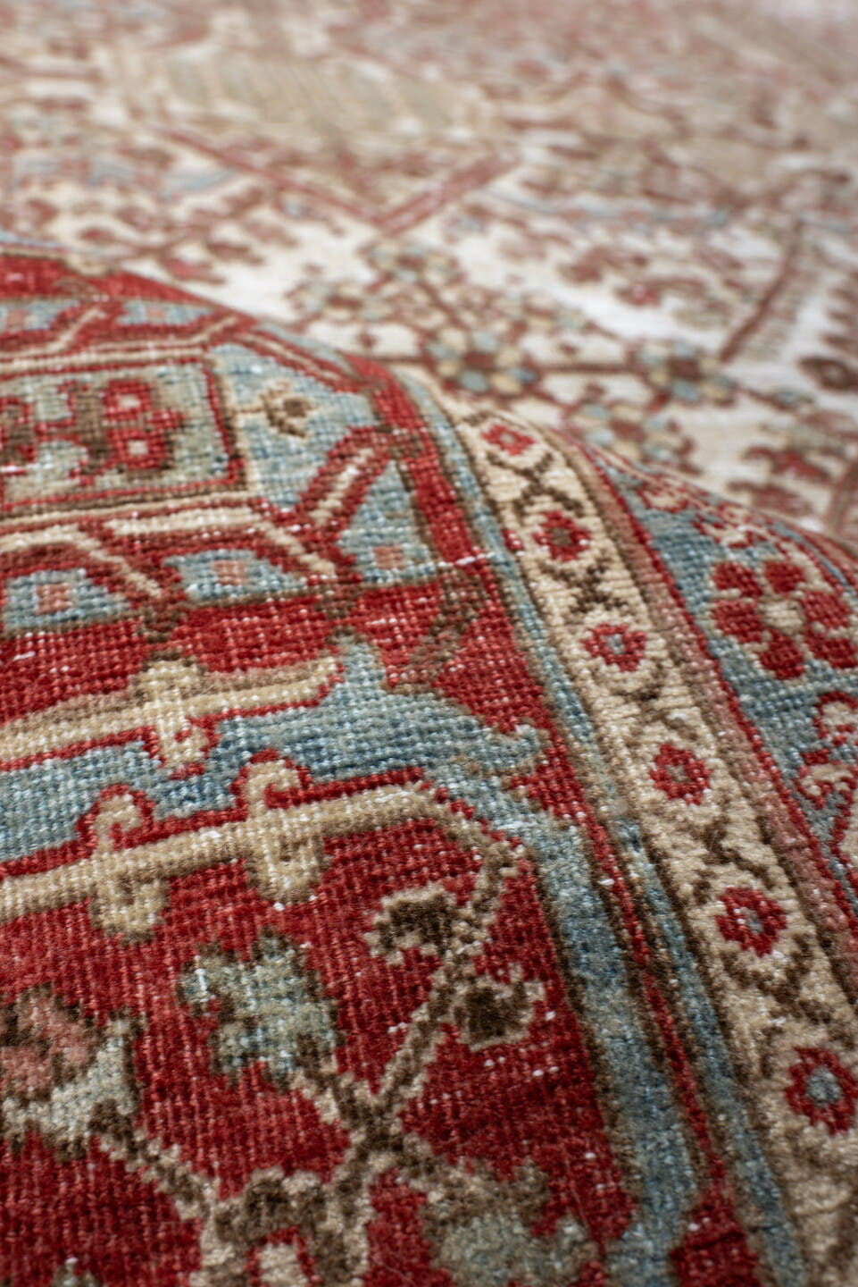 7' x 10' one-of-a-kind handmade antique Joshegan large size rug. Color palette: ivory, rust, sky_blue, camel, brick, taupe