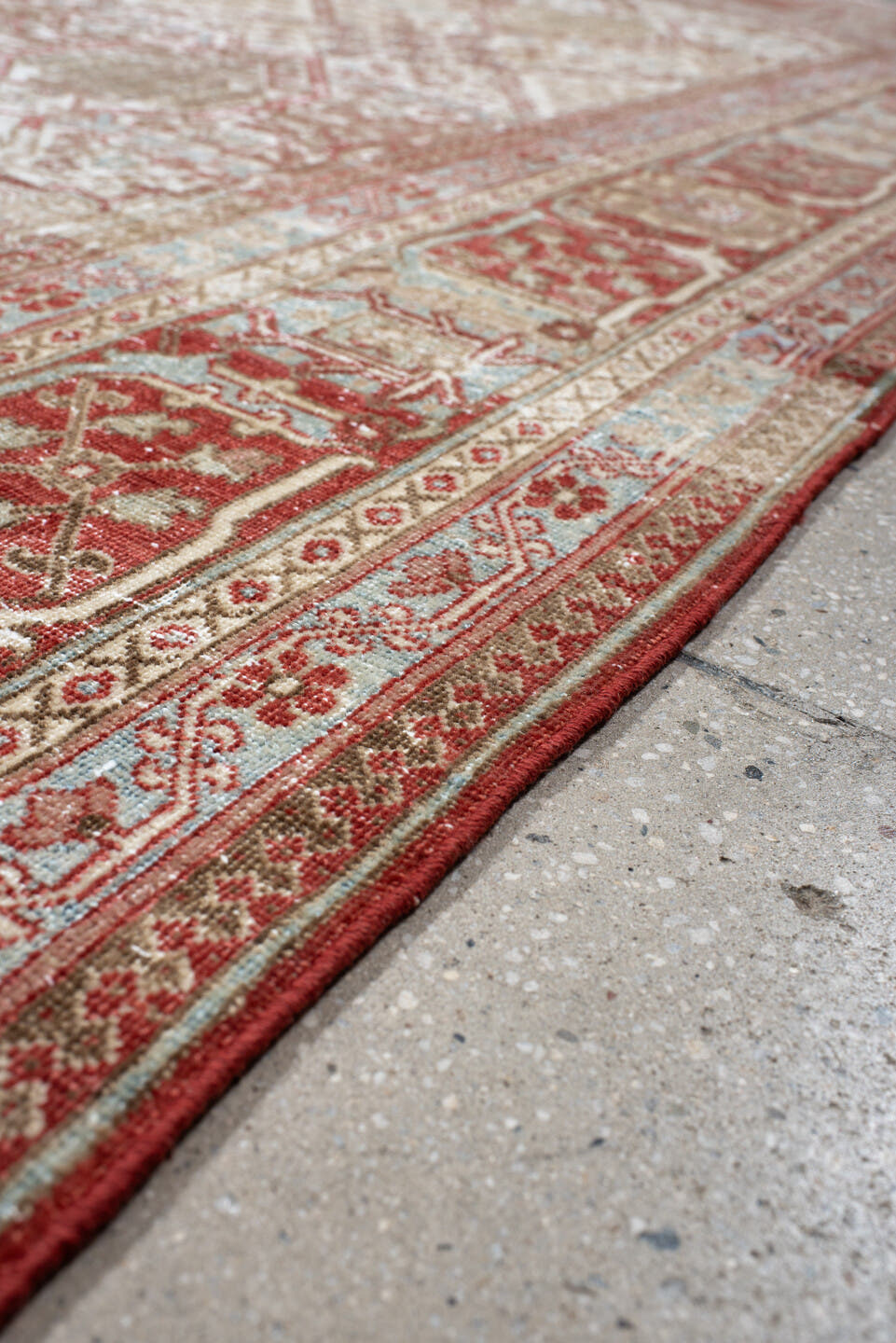 7' x 10' one-of-a-kind handmade antique Joshegan large size rug. Color palette: ivory, rust, sky_blue, camel, brick, taupe