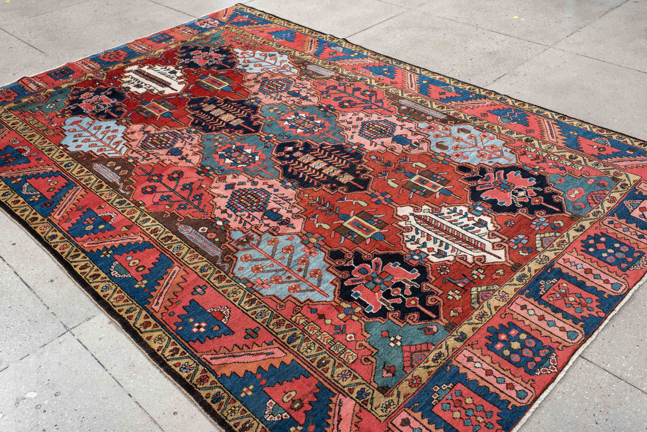 6' x 10' one-of-a-kind handmade antique Baktiary large size rug. Color palette: rust, indigo, rose, ivory, sky blue, navy