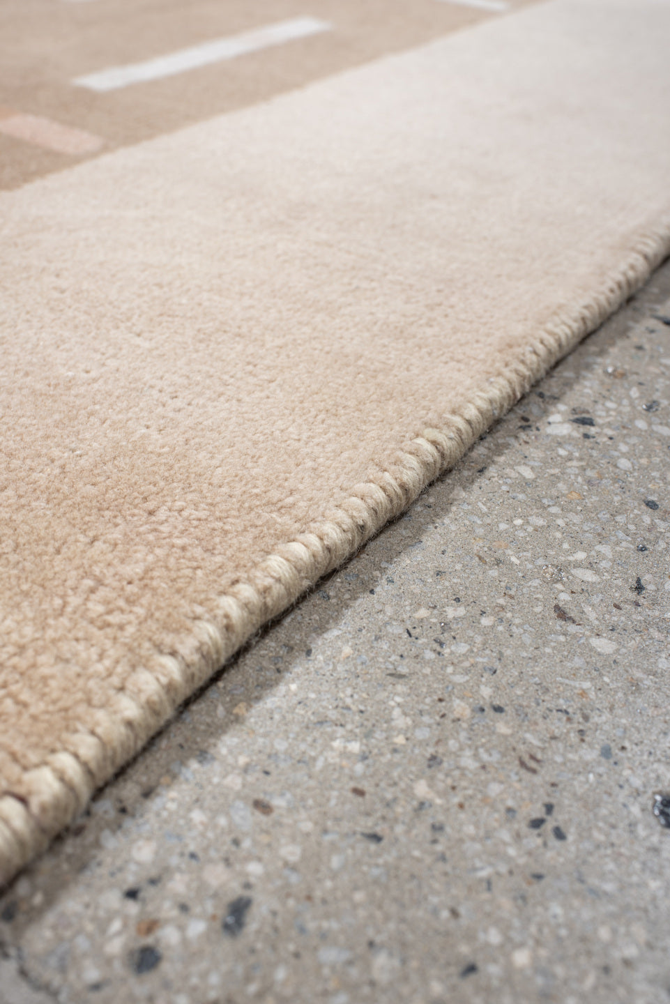 6' x 6' one-of-a-kind handmade handmade Modern rug. Color palette: taupe, ivory, blush, coral, beige, gray, pink, terracotta