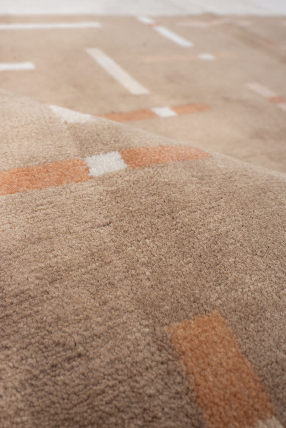 6' x 6' one-of-a-kind handmade handmade Modern rug. Color palette: taupe, ivory, blush, coral, beige, gray, pink, terracotta