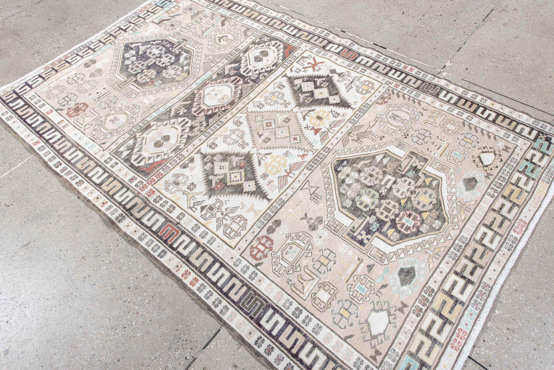 4' x 6' one-of-a-kind handmade antique Sumak small size rug. Color palette: ivory, charcoal, taupe, soft blue, rust, camel