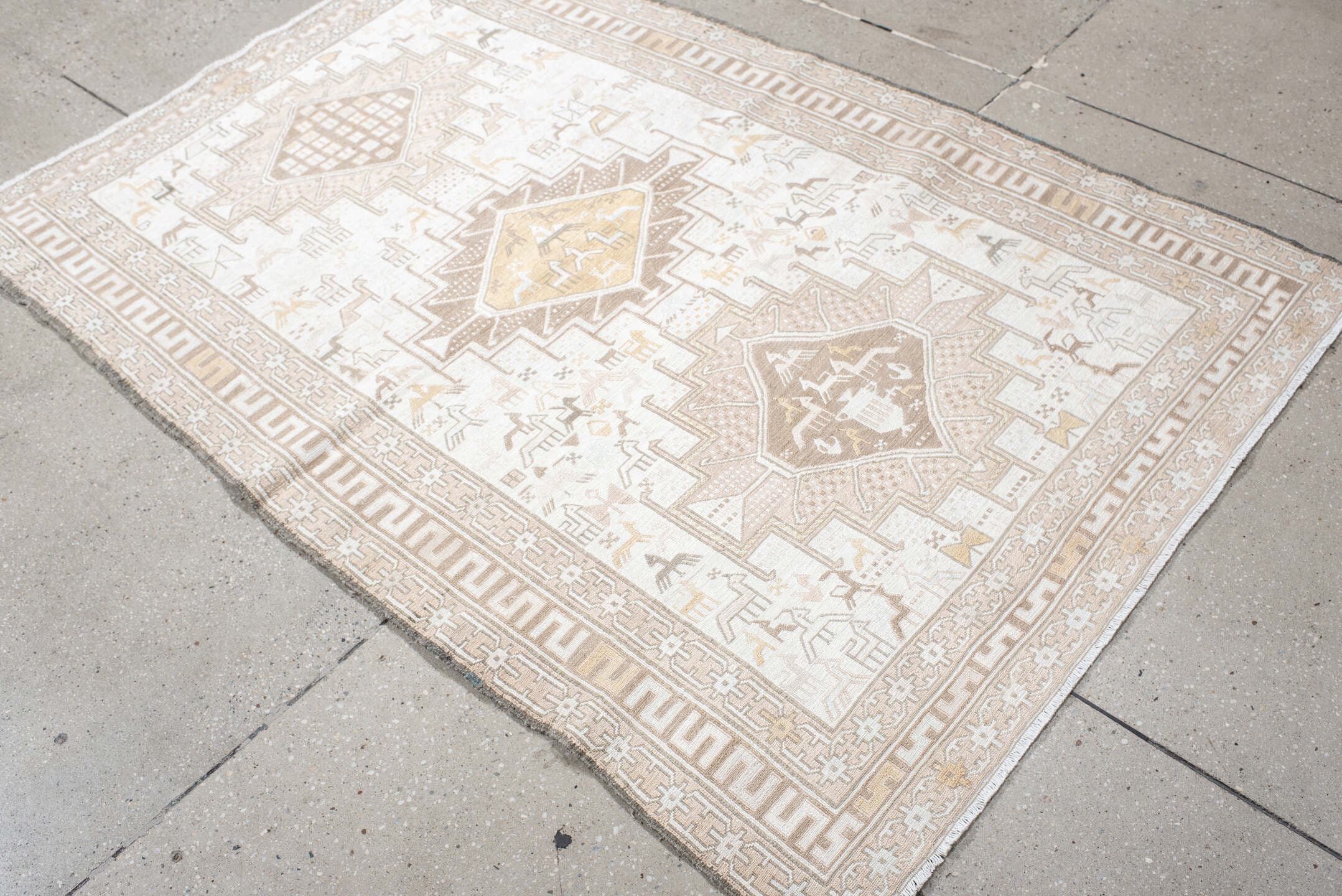 3' x 5' one-of-a-kind handmade vintage Sumak small size rug. Color palette: ivory, beige, taupe, cream, pale gold, camel