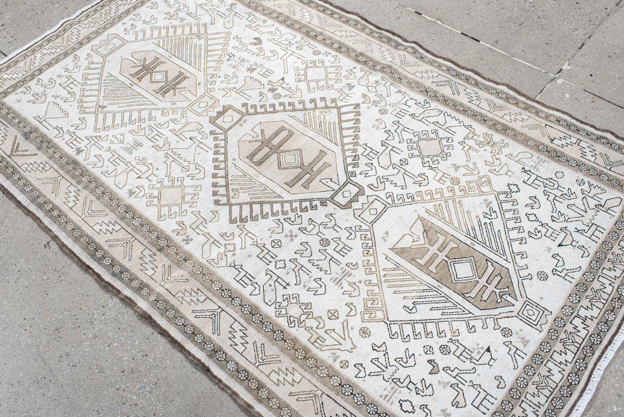 3' x 5' one-of-a-kind handmade antique Sumak small size rug. Color palette: ivory, taupe, brown, camel, gray, beige