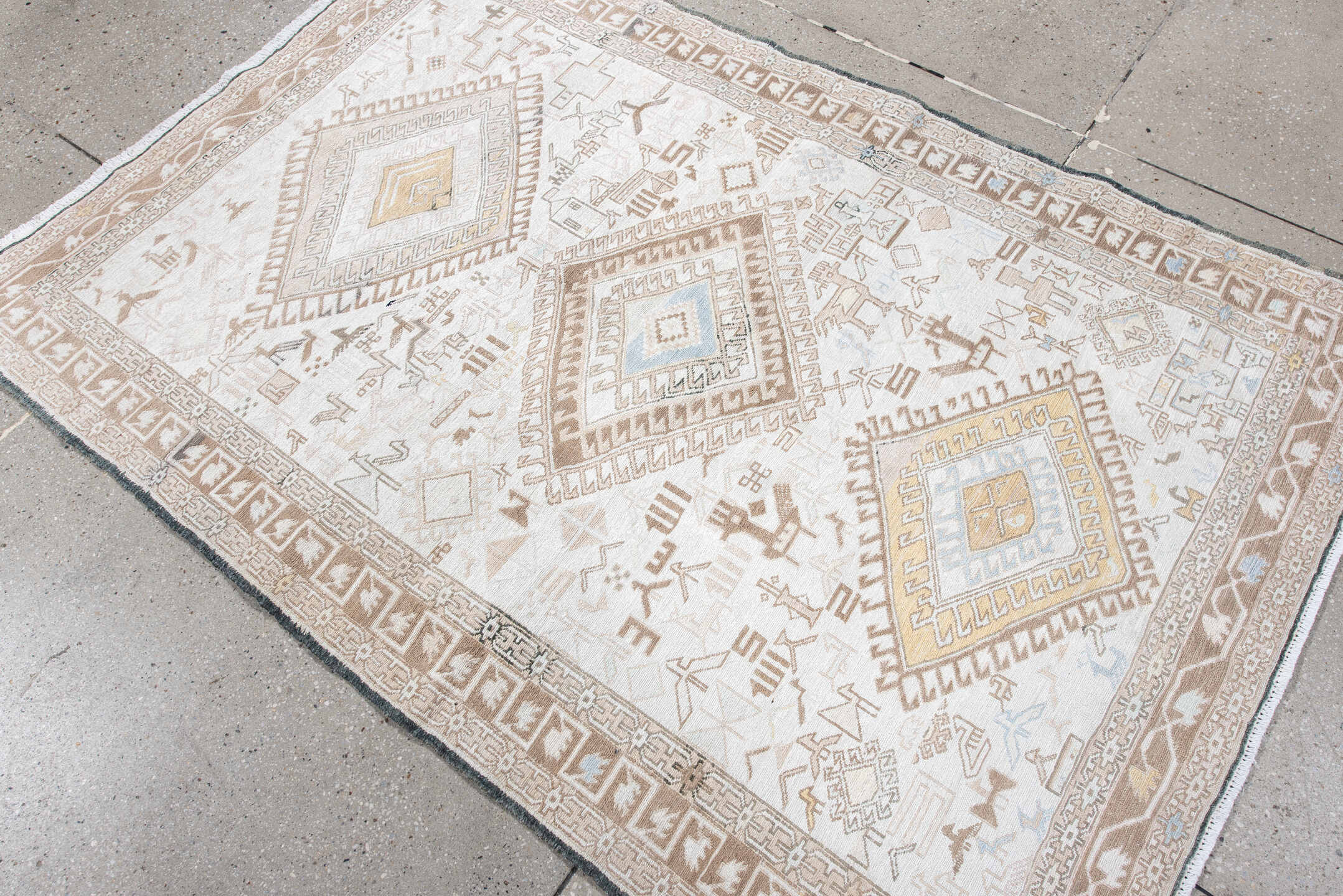 4' x 5' one-of-a-kind handmade antique Sumak small size rug. Color palette: ivory, camel, taupe, pale blue, soft gold, beige