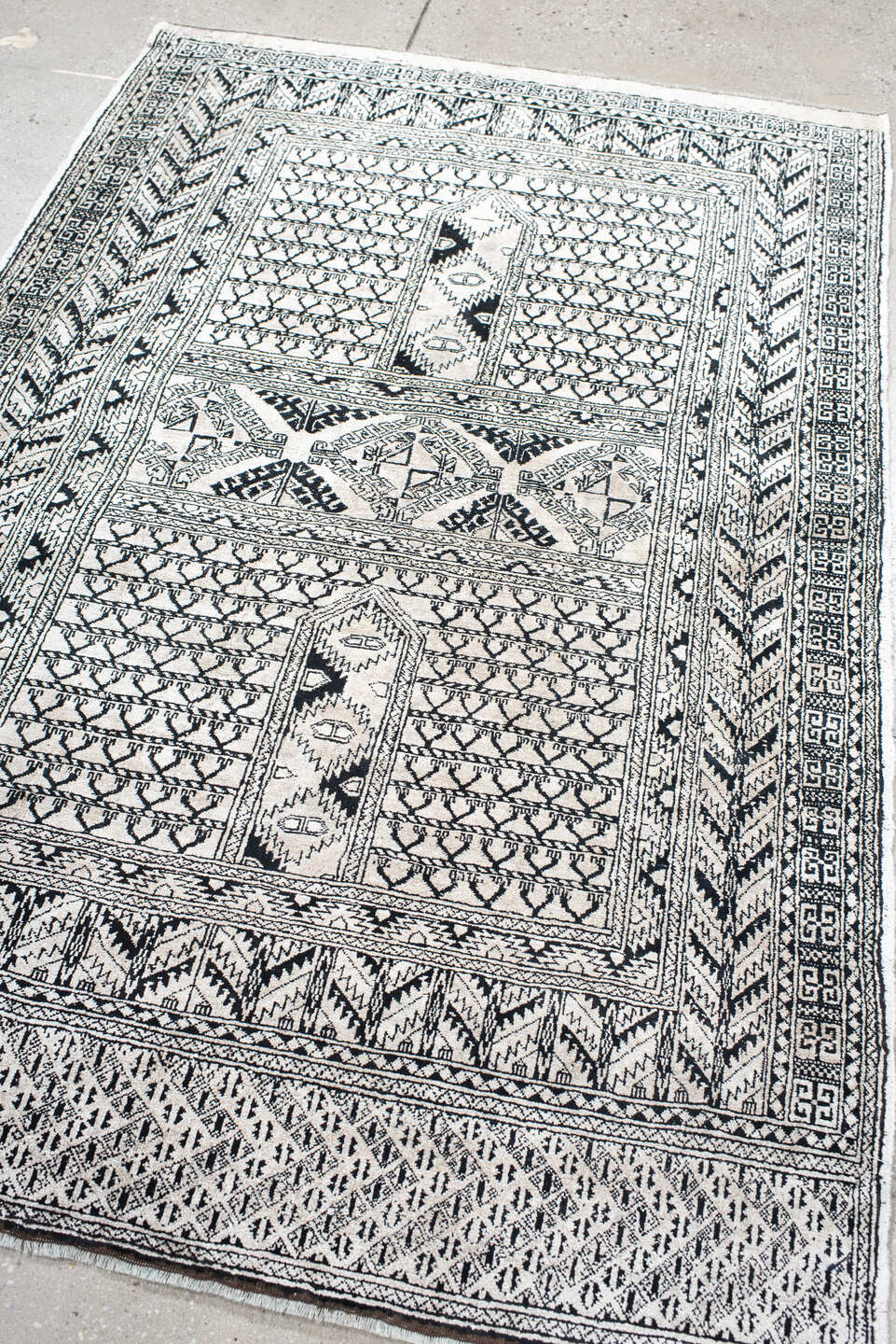 3' x 5' one-of-a-kind handmade vintage Afghan small size rug. Color palette: ivory, charcoal, black, gray