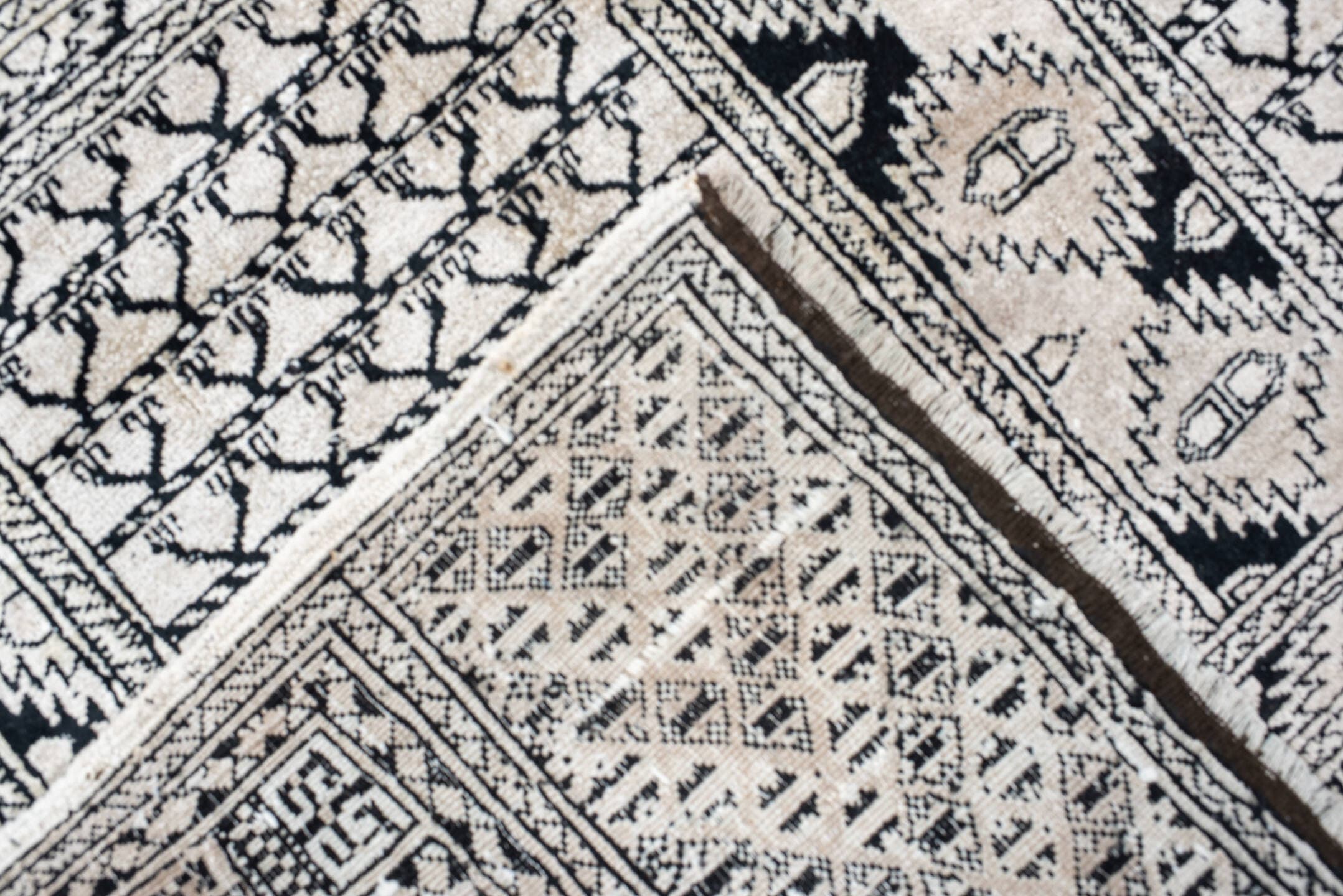 3' x 5' one-of-a-kind handmade vintage Afghan small size rug. Color palette: ivory, charcoal, black, gray