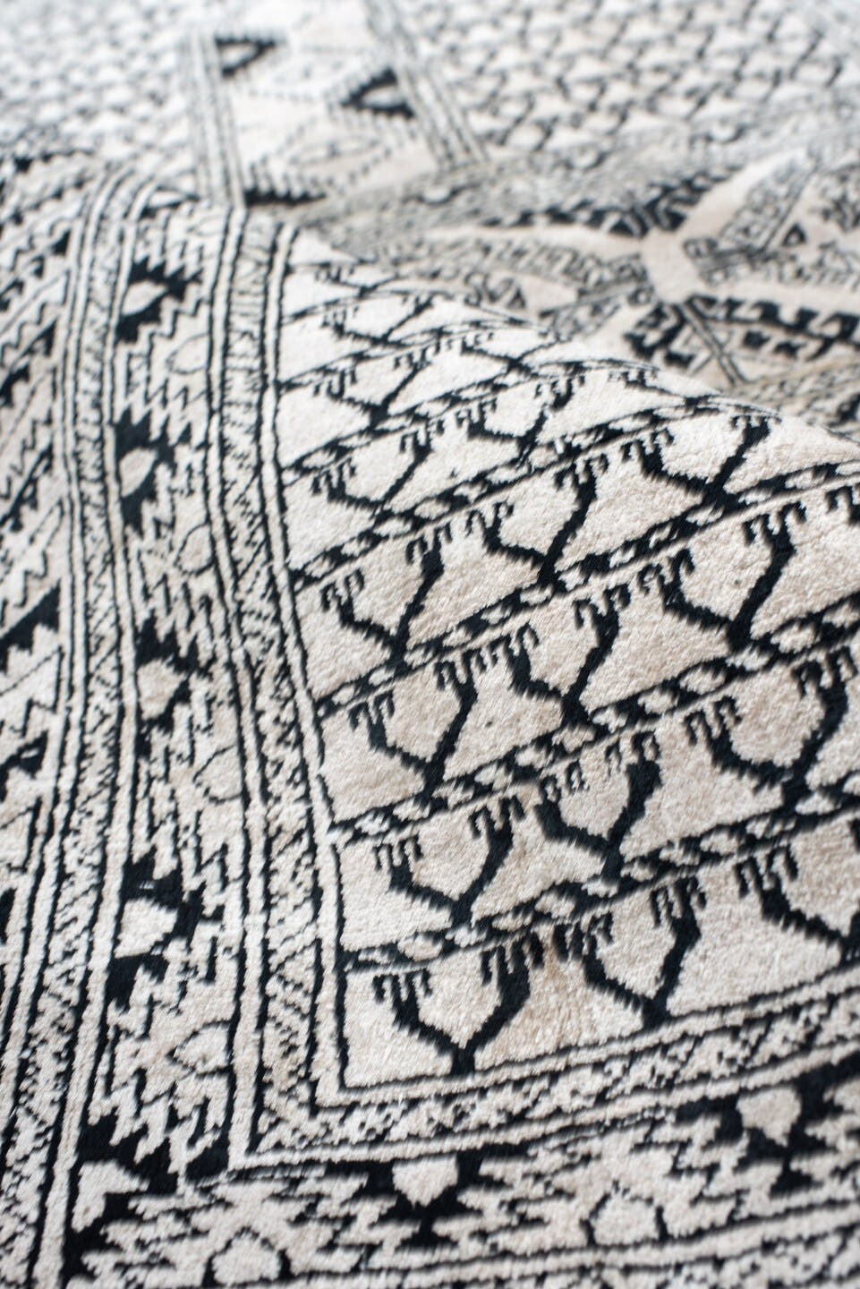 3' x 5' one-of-a-kind handmade vintage Afghan small size rug. Color palette: ivory, charcoal, black, gray