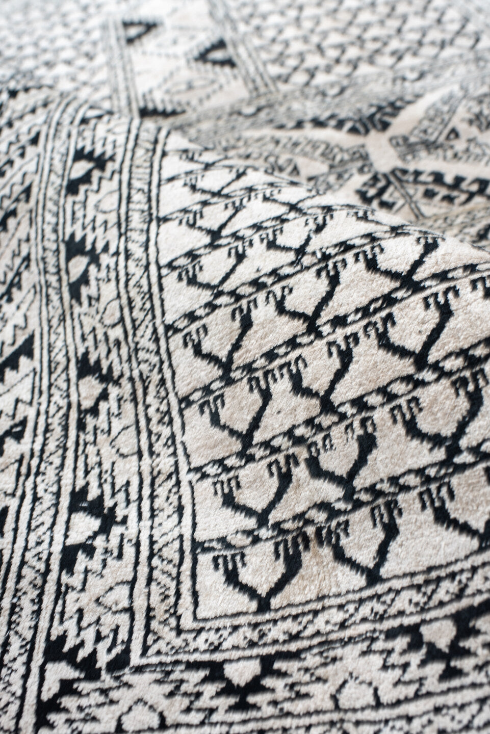 3' x 5' one-of-a-kind handmade vintage Afghan small size rug. Color palette: ivory, charcoal, black, gray