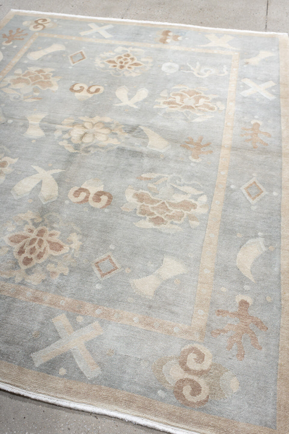 6' x 7' one-of-a-kind handmade antique Tibetan rug. Color palette: pale blue, ivory, blush, sand, taupe, light blue, pink