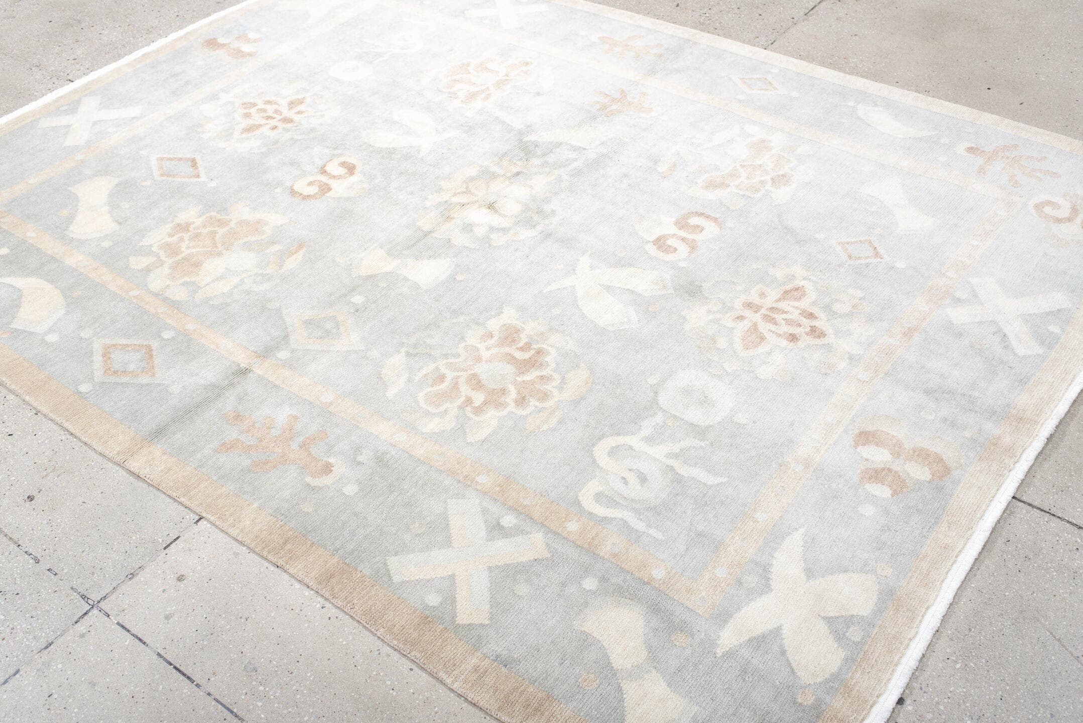 6' x 7' one-of-a-kind handmade antique Tibetan rug. Color palette: pale blue, ivory, blush, sand, taupe, light blue, pink