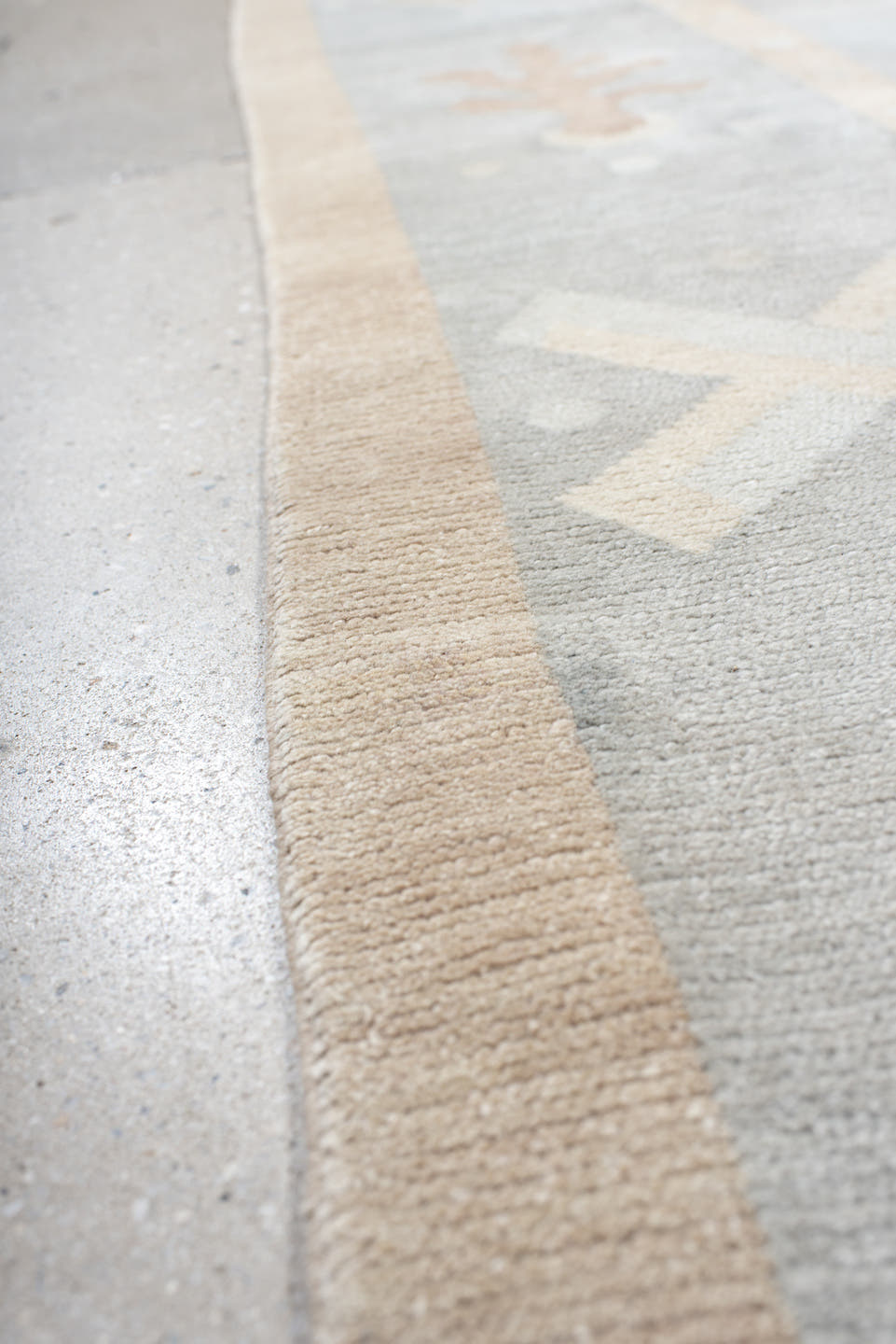 6' x 7' one-of-a-kind handmade antique Tibetan rug. Color palette: pale blue, ivory, blush, sand, taupe, light blue, pink