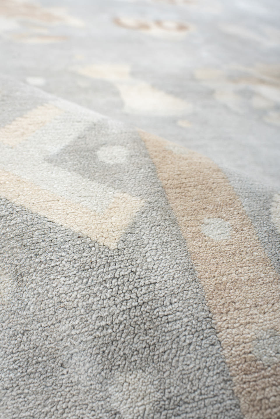 6' x 7' one-of-a-kind handmade antique Tibetan rug. Color palette: pale blue, ivory, blush, sand, taupe, light blue, pink