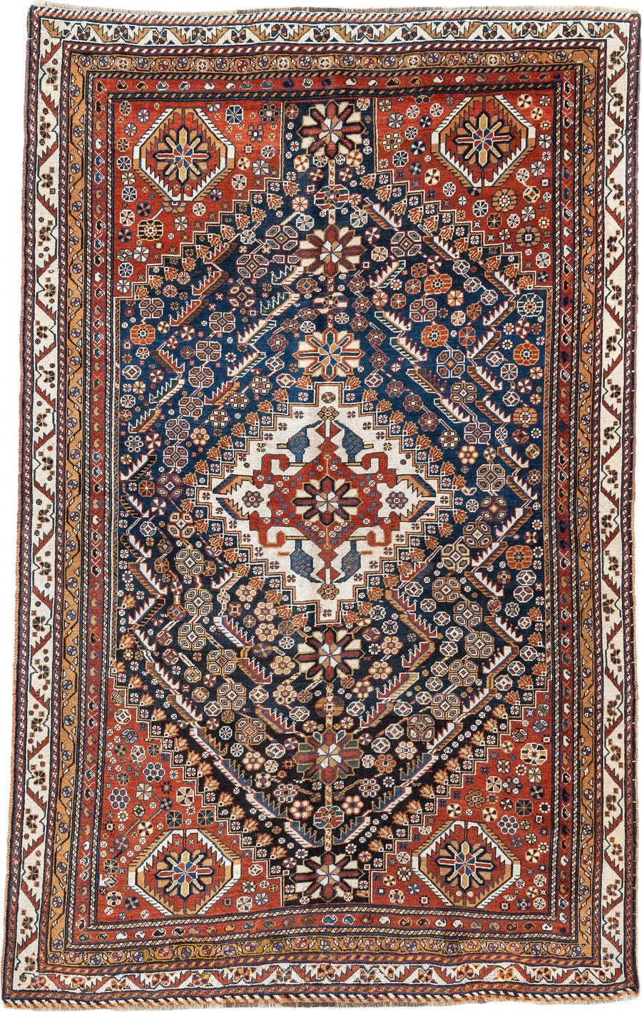 4' x 8' one-of-a-kind handmade vintage Shirvan medium size rug. Color palette: rust, navy, ivory, camel, saffron, indigo
