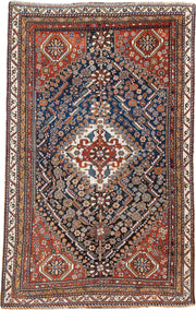 4' x 8' one-of-a-kind handmade vintage Shirvan medium size rug. Color palette: rust, navy, ivory, camel, saffron, indigo