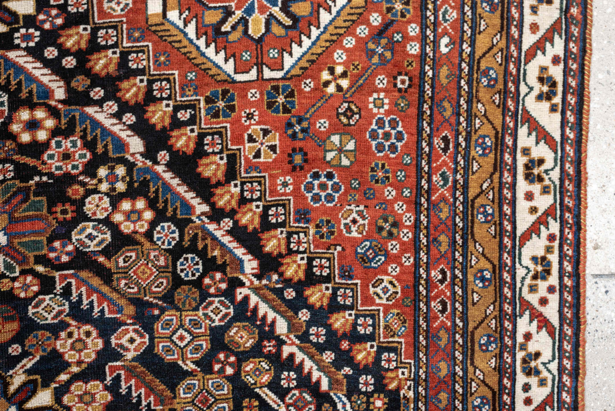 4' x 8' one-of-a-kind handmade vintage Shirvan medium size rug. Color palette: rust, navy, ivory, camel, saffron, indigo