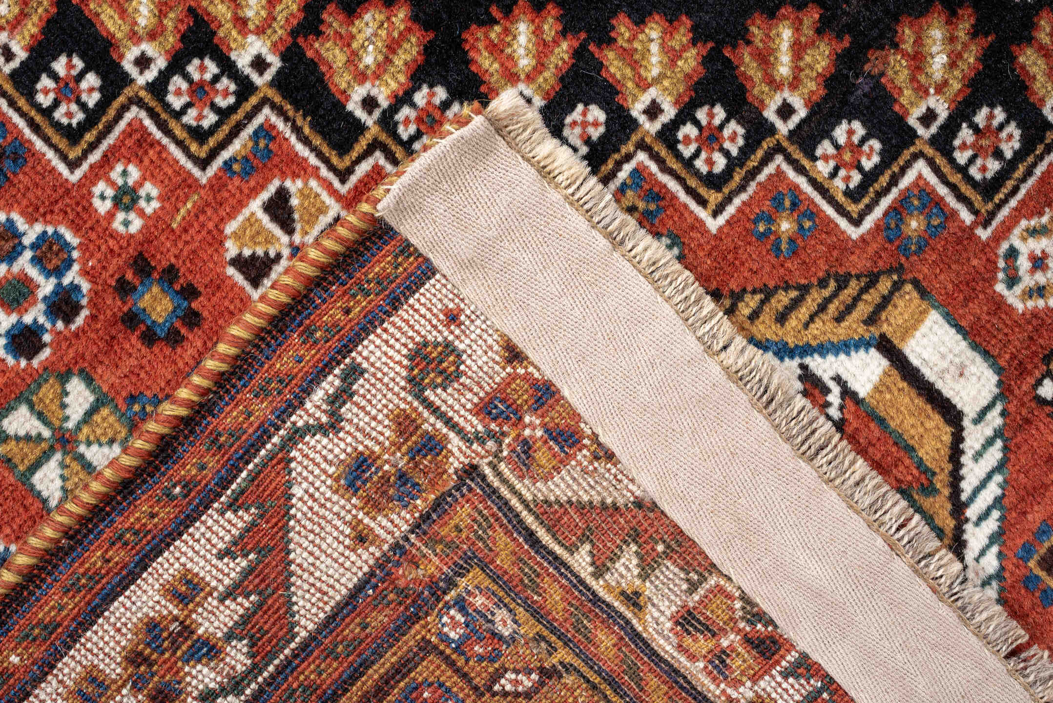 4' x 8' one-of-a-kind handmade vintage Shirvan medium size rug. Color palette: rust, navy, ivory, camel, saffron, indigo