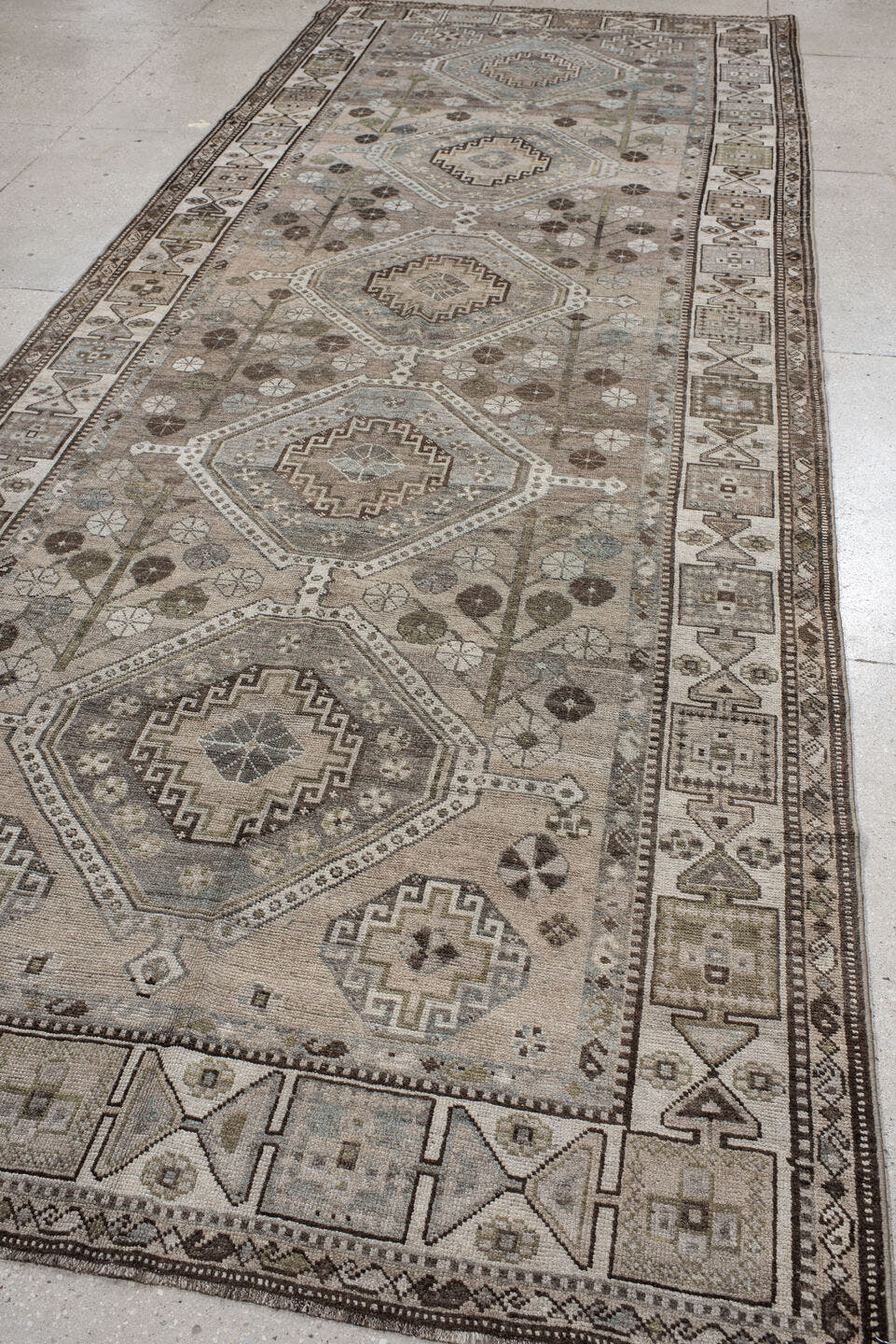 5' x 14' one-of-a-kind handmade antique Shiraz rug. Color palette: taupe, ivory, brown, slate, camel, charcoal, sage, beige