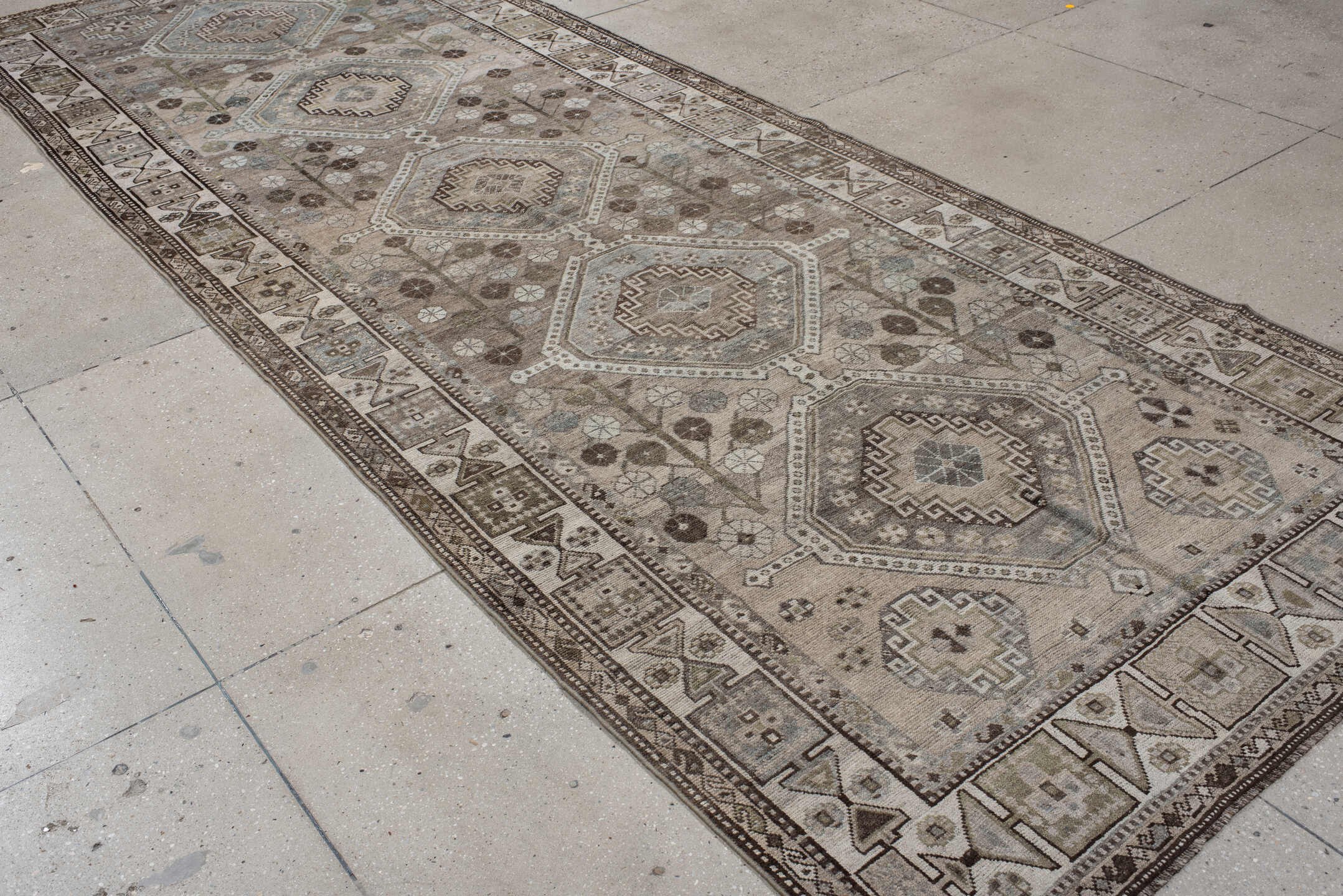 5' x 14' one-of-a-kind handmade antique Shiraz rug. Color palette: taupe, ivory, brown, slate, camel, charcoal, sage, beige