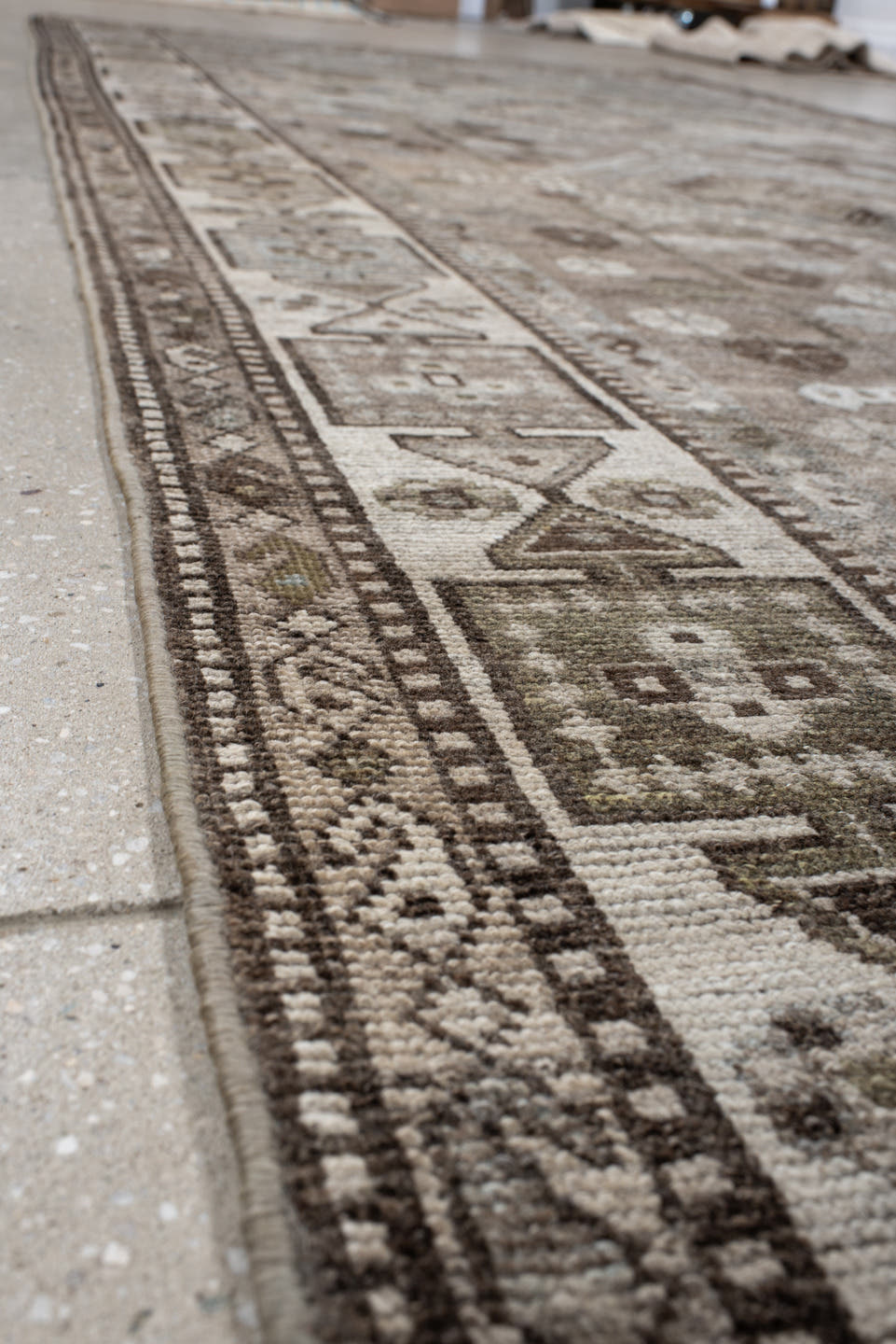 5' x 14' one-of-a-kind handmade antique Shiraz rug. Color palette: taupe, ivory, brown, slate, camel, charcoal, sage, beige