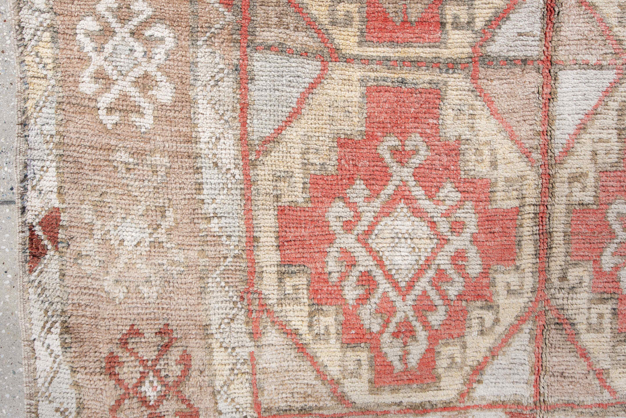 4' x 7' one-of-a-kind handmade antique Anatolian rug. Color palette: ivory, camel, coral, taupe, faded red, light gray