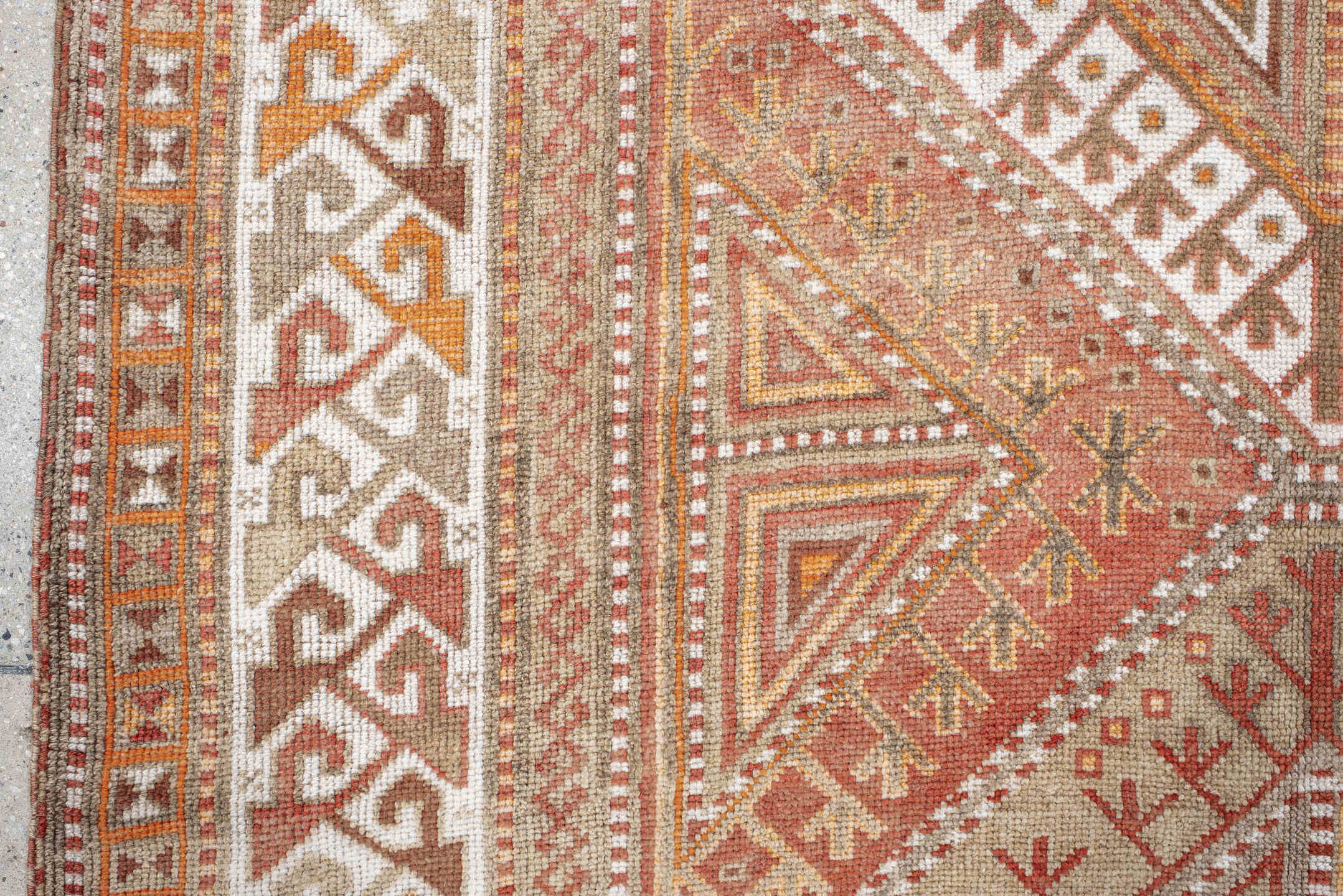4' x 12' one-of-a-kind handmade vintage Anatol runner rug. Color palette: brown, gray, light gray, off-white, orange, pink