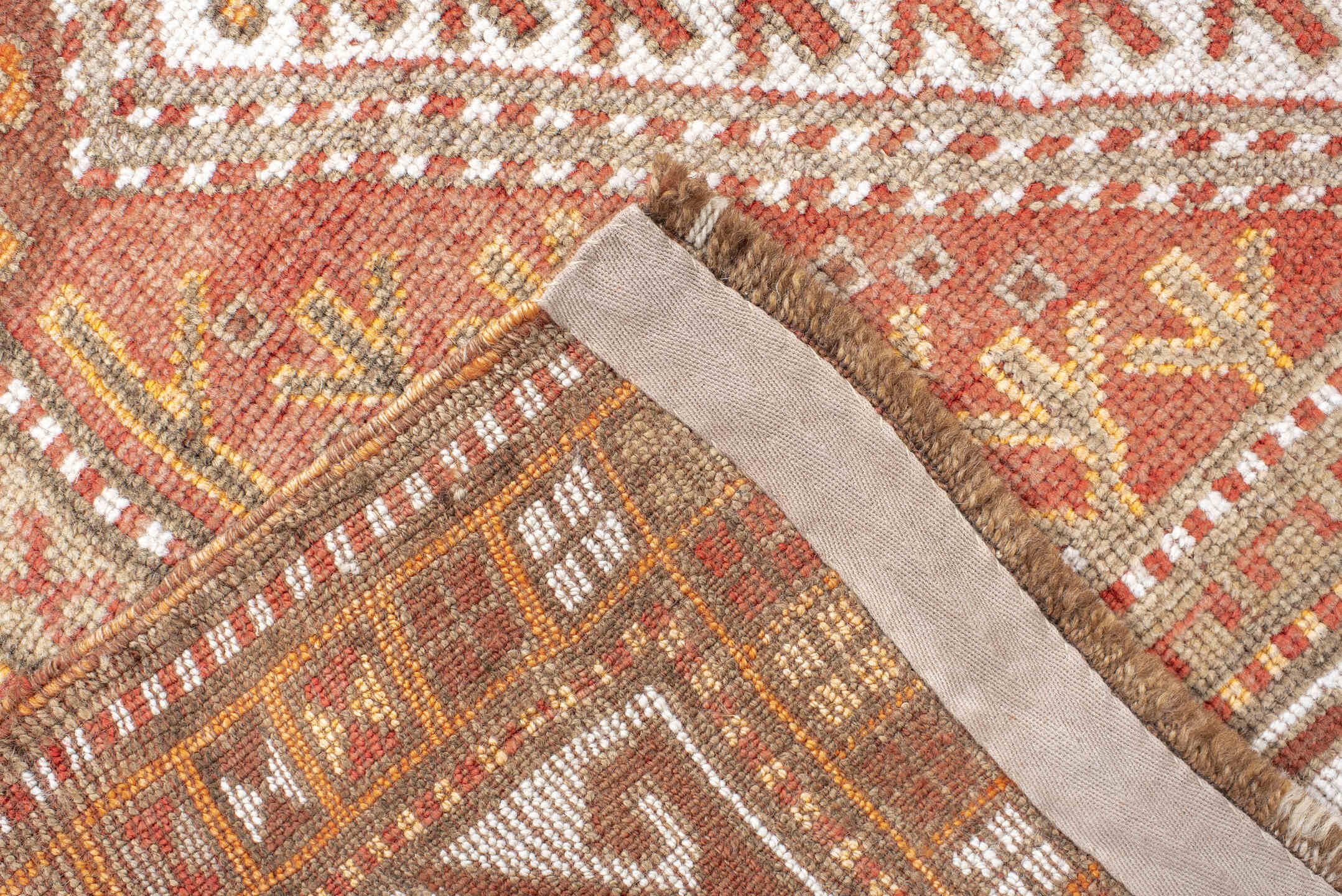 4' x 12' one-of-a-kind handmade vintage Anatol runner rug. Color palette: brown, gray, light gray, off-white, orange, pink